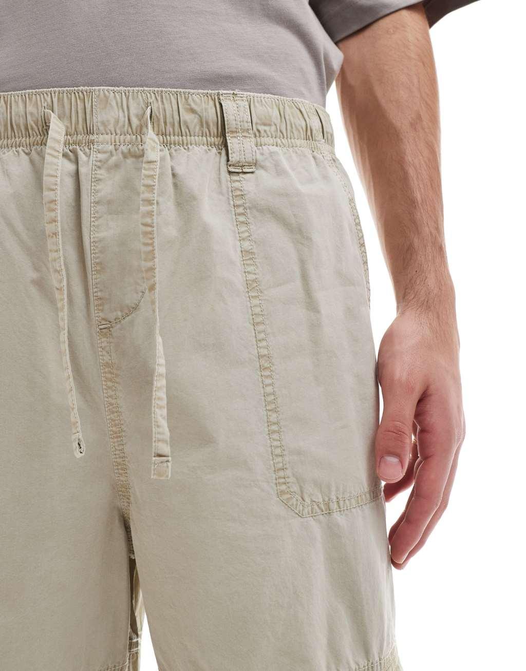 ASOS DESIGN washed baggy cargo pants with panel detailing in stone Product Image