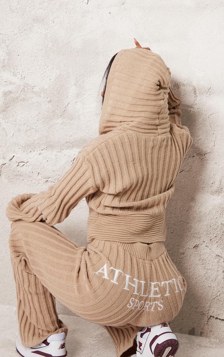 Petite Stone Athletic Sport Embroidered Knit Flared Pants Product Image