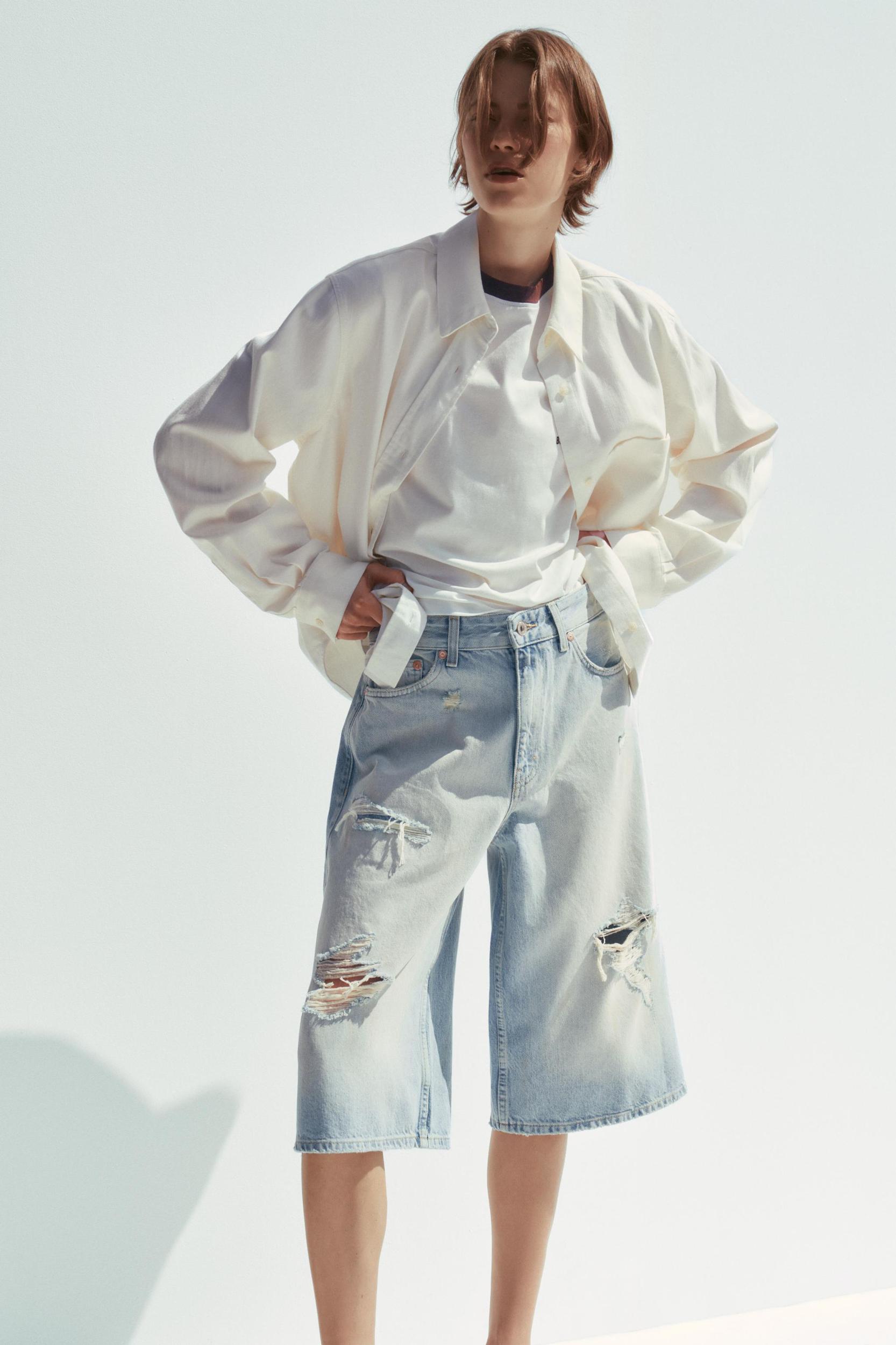 MID-RISE RIPPED DENIM BERMUDA JORTS Product Image