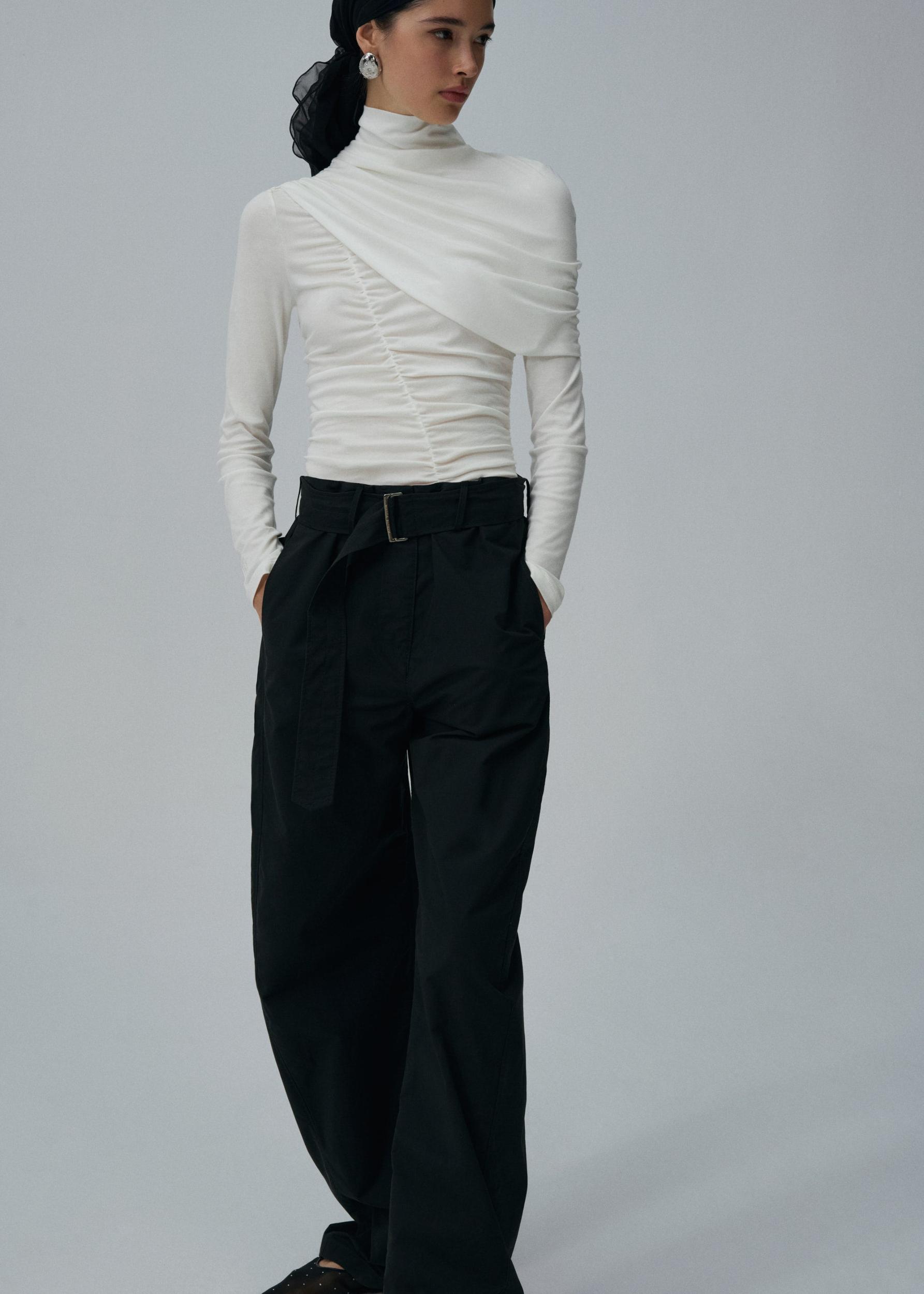 Draped high neck blouse in cream Product Image