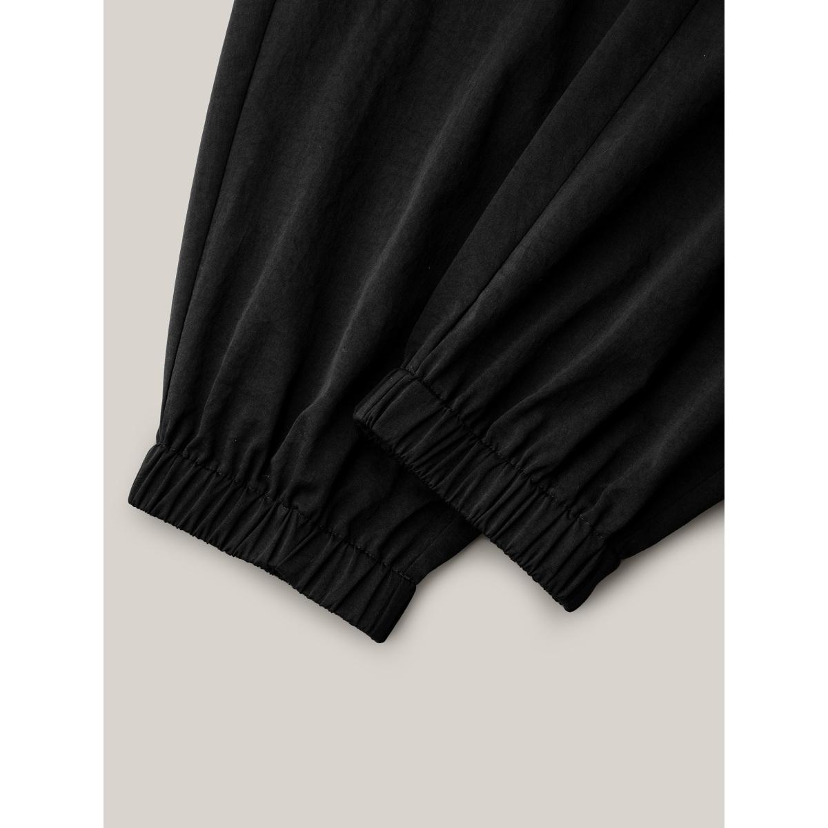 Plus Size Ruffled Waist Drawstring Tapered Pants Women Black Leisure Mid Rise Casual Pants BloomChic 22-24/3X Product Image