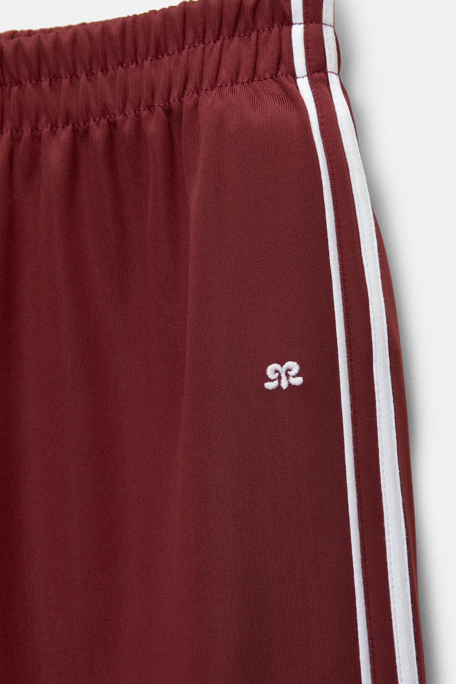 Tracksuit pants with side stripes Product Image