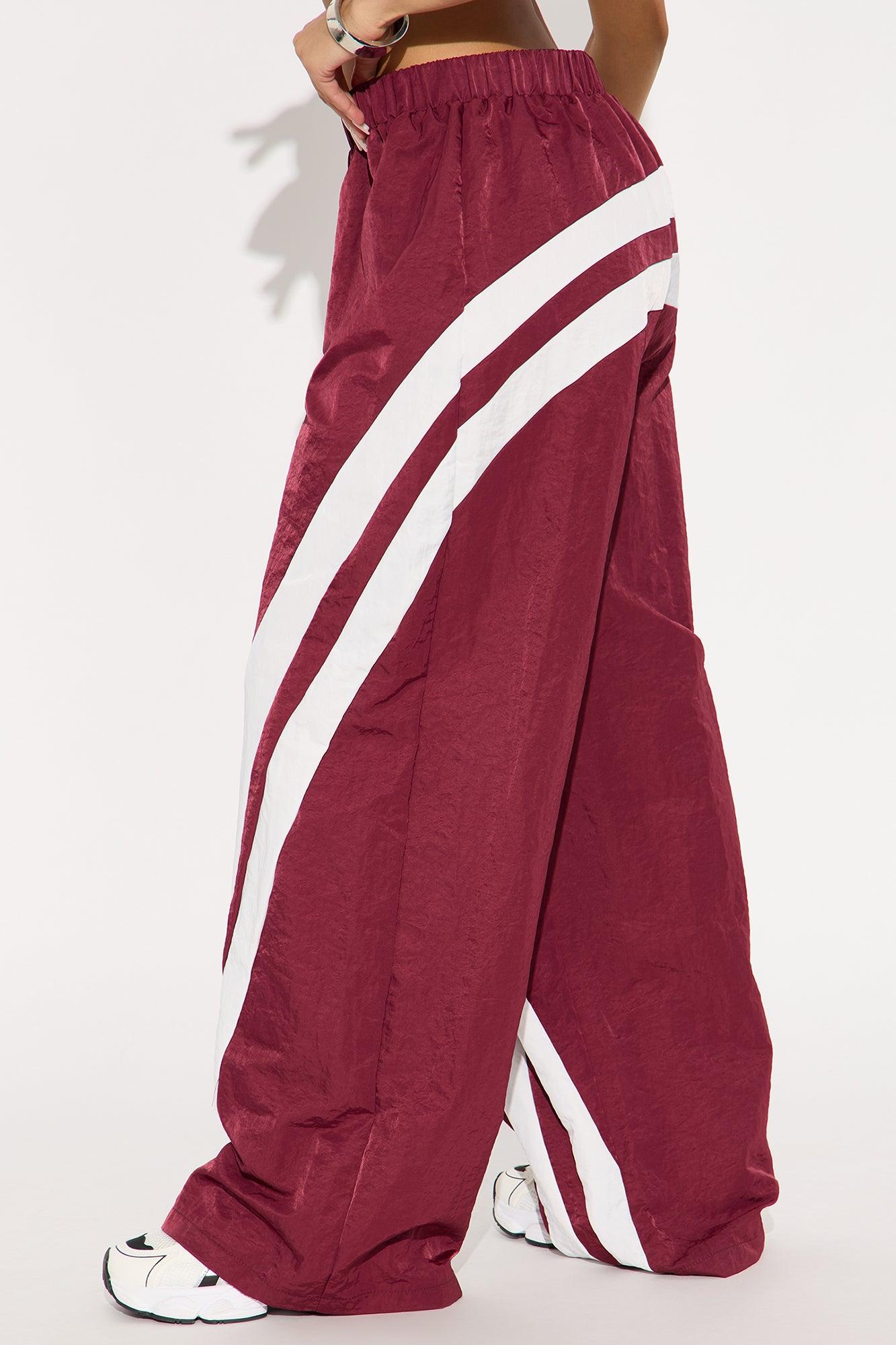 Follow The Curve Windbreaker Track Pant - Burgundy Female Product Image
