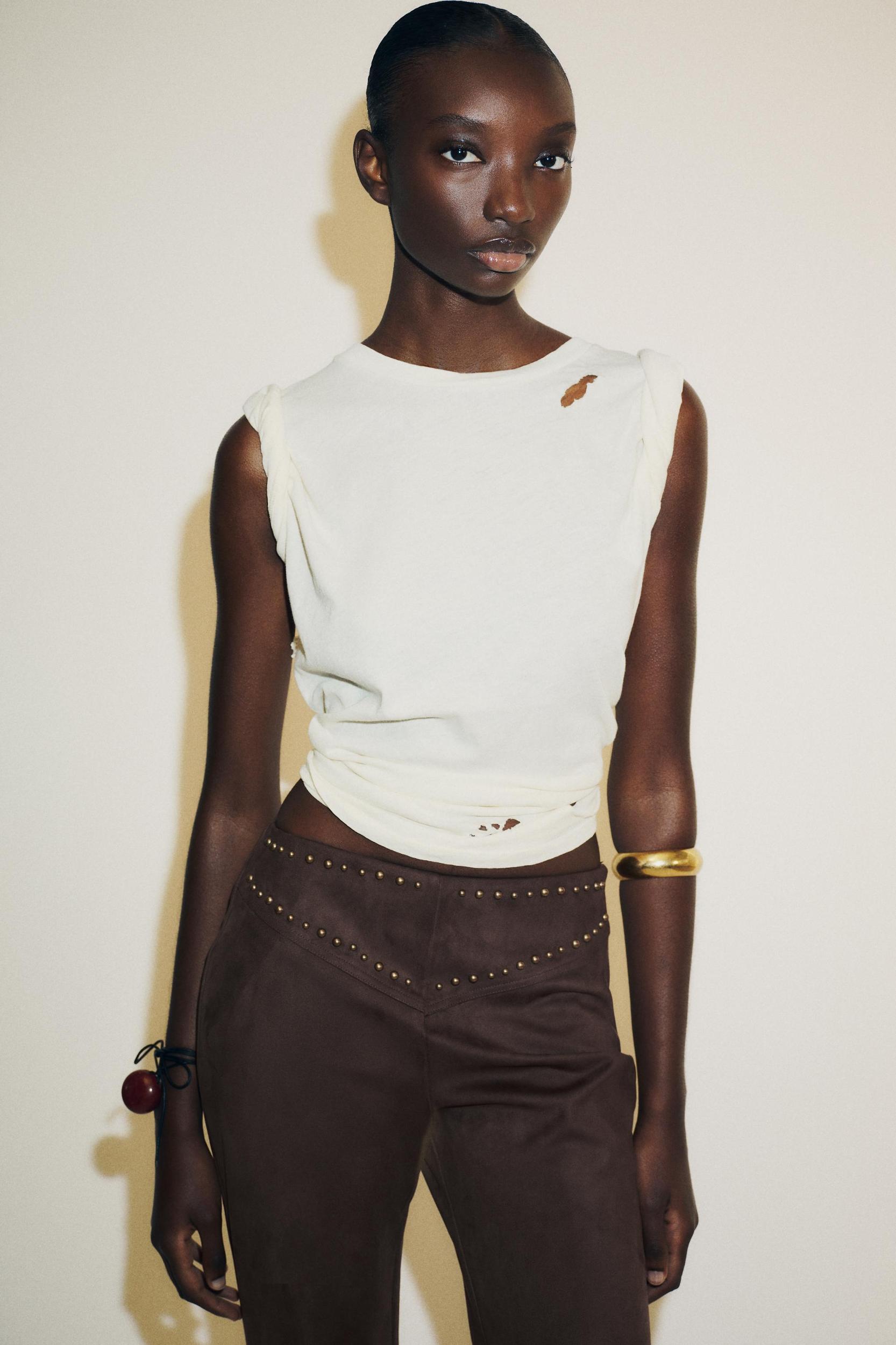 FAUX SUEDE STUDDED FLARE PANTS Product Image