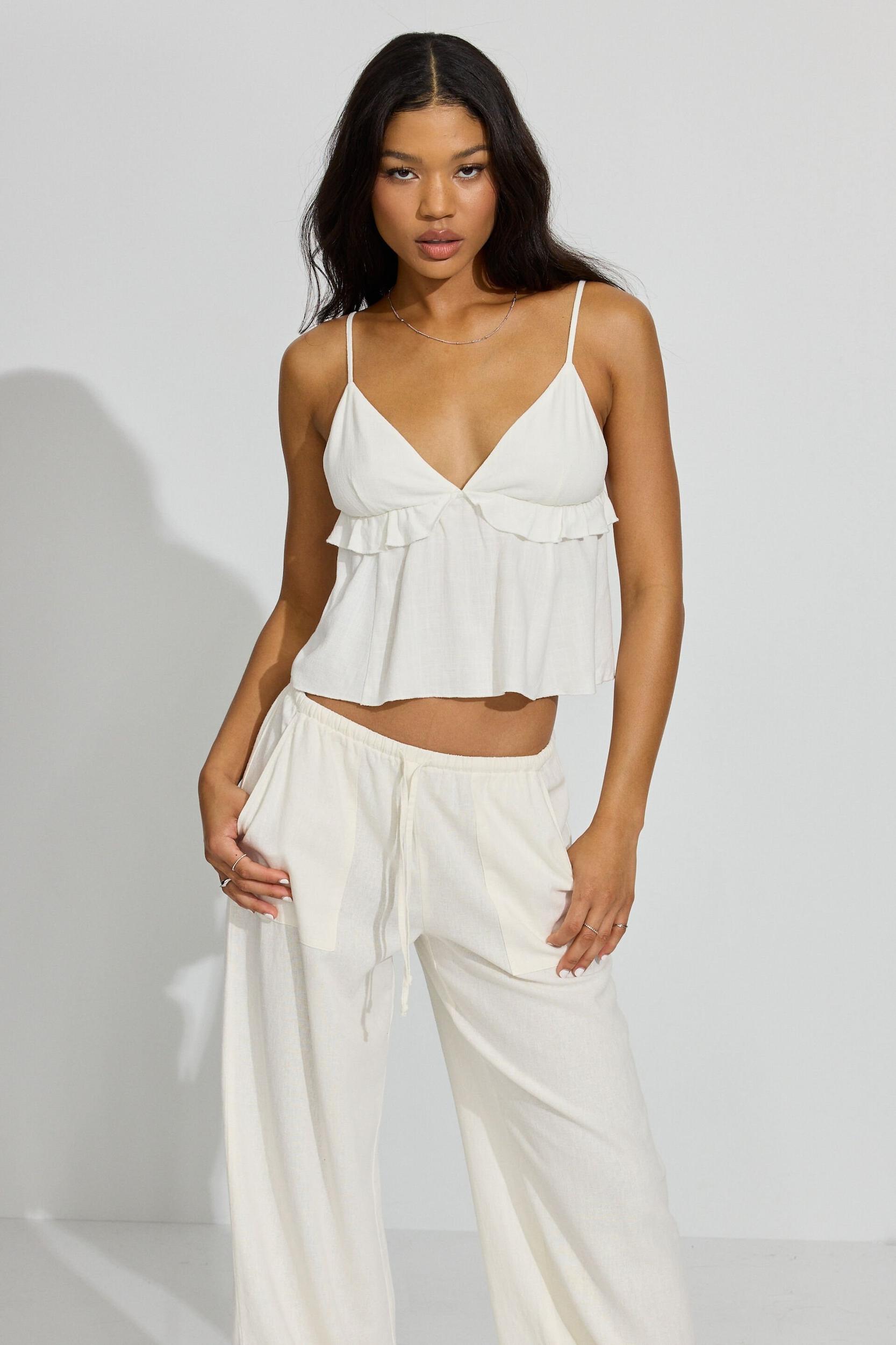 Strappy Peplum Cami Top Product Image