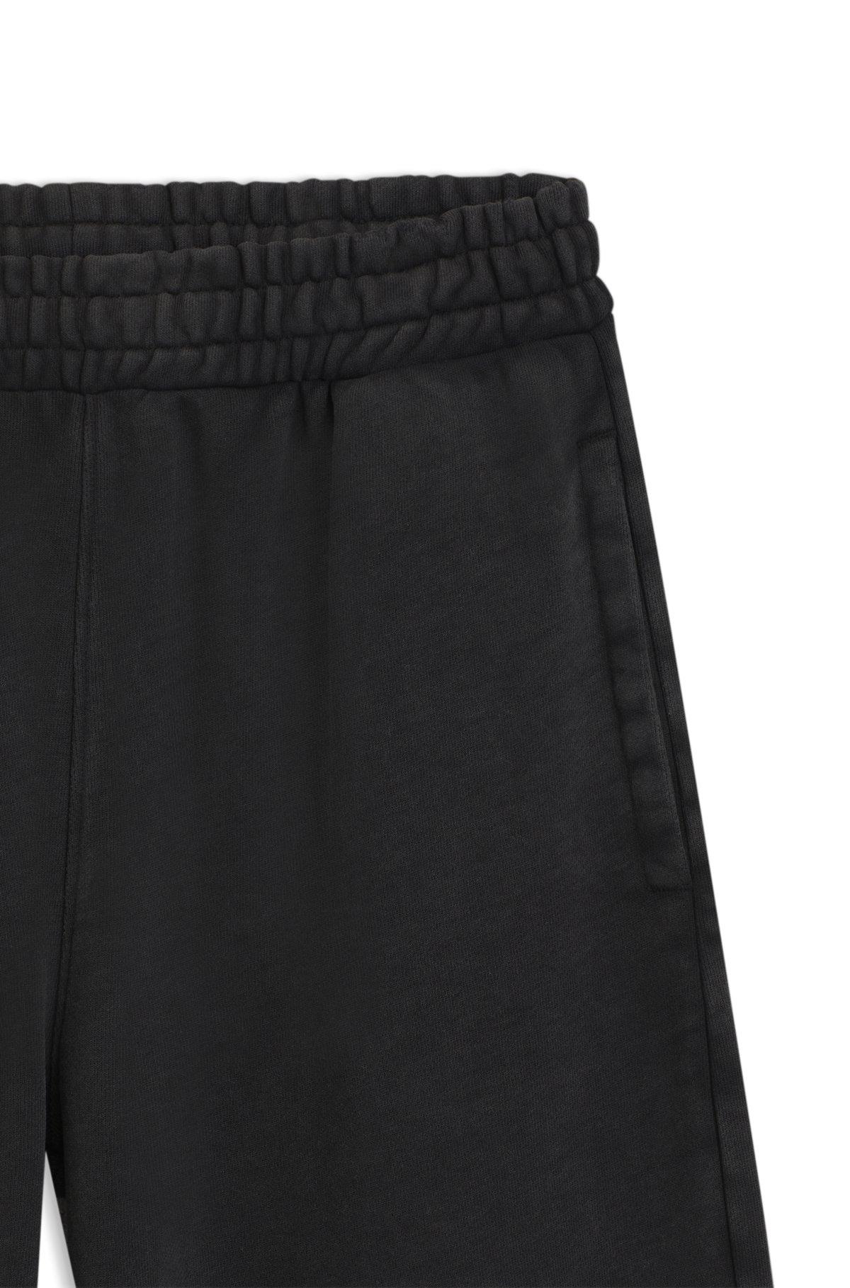 Loose-fit tracksuit bottoms in cotton terry Product Image