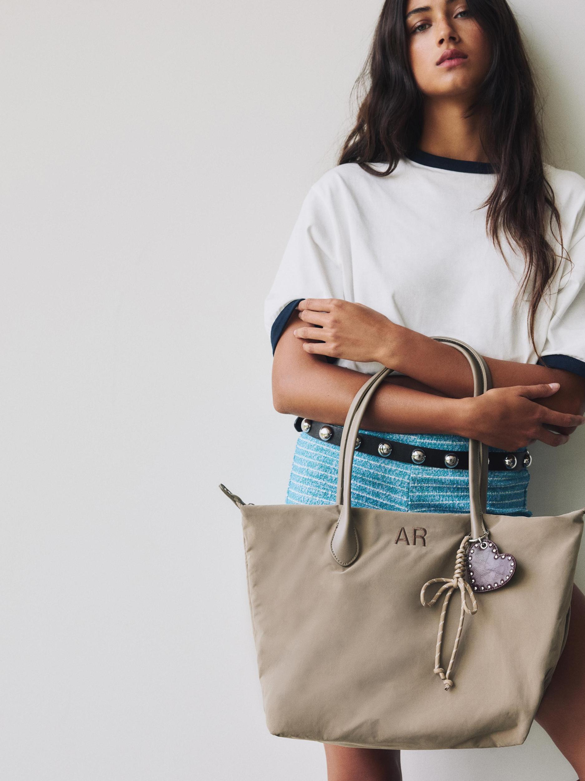 Nylon shopper bag with charm detail Product Image
