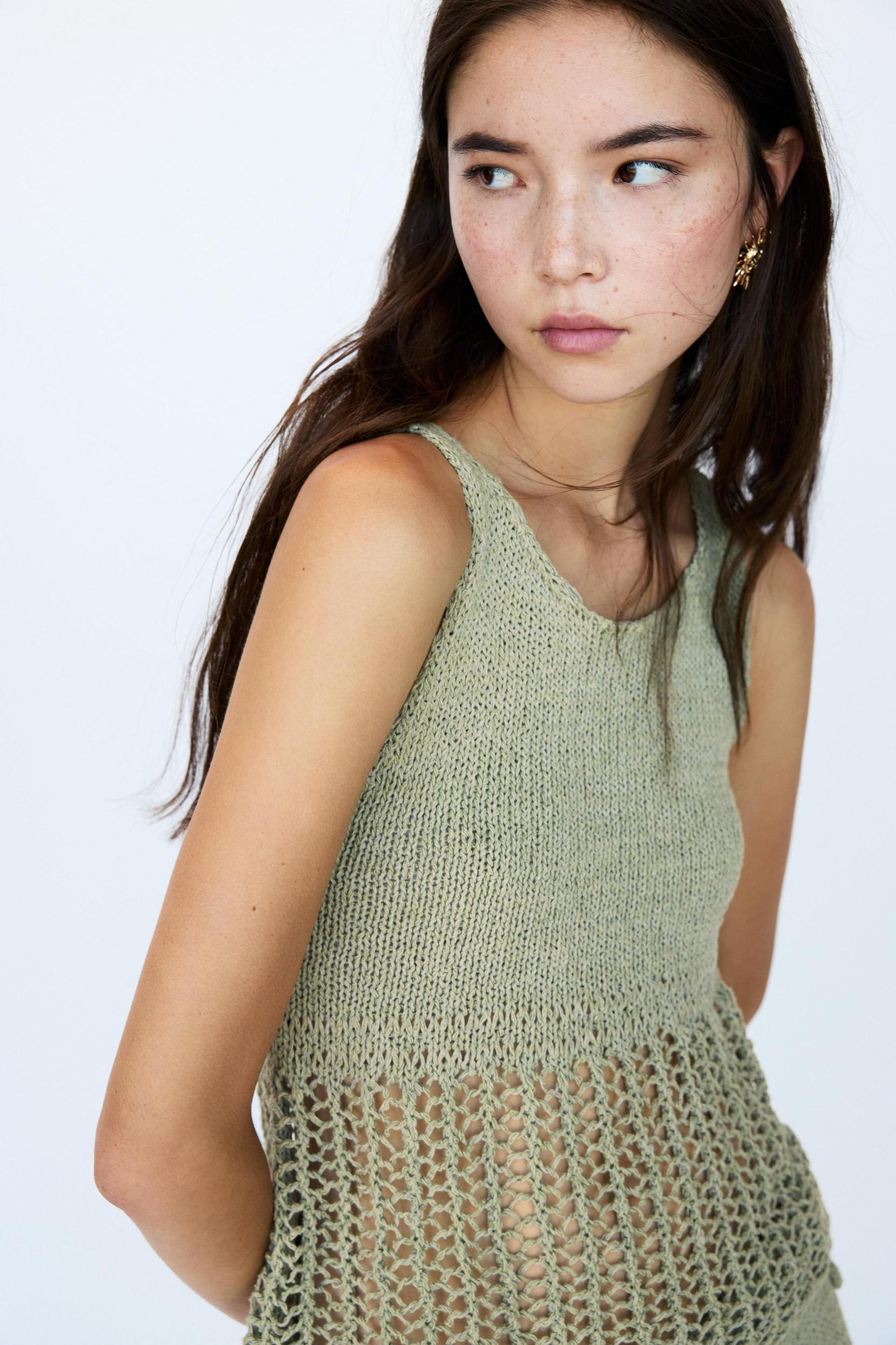 Knit top with an open knit hem Product Image