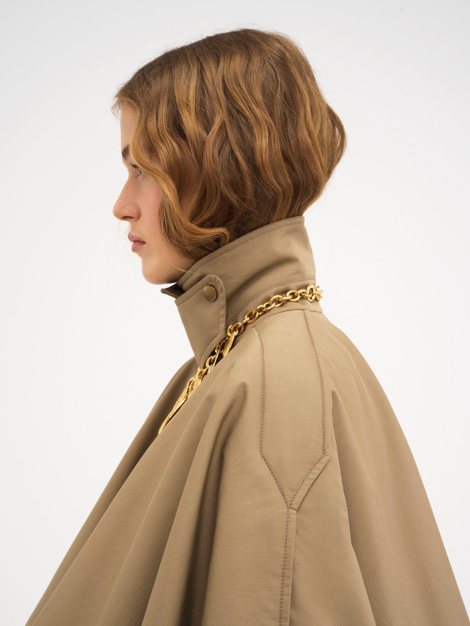 Short quilted cape in cotton gabardine Product Image