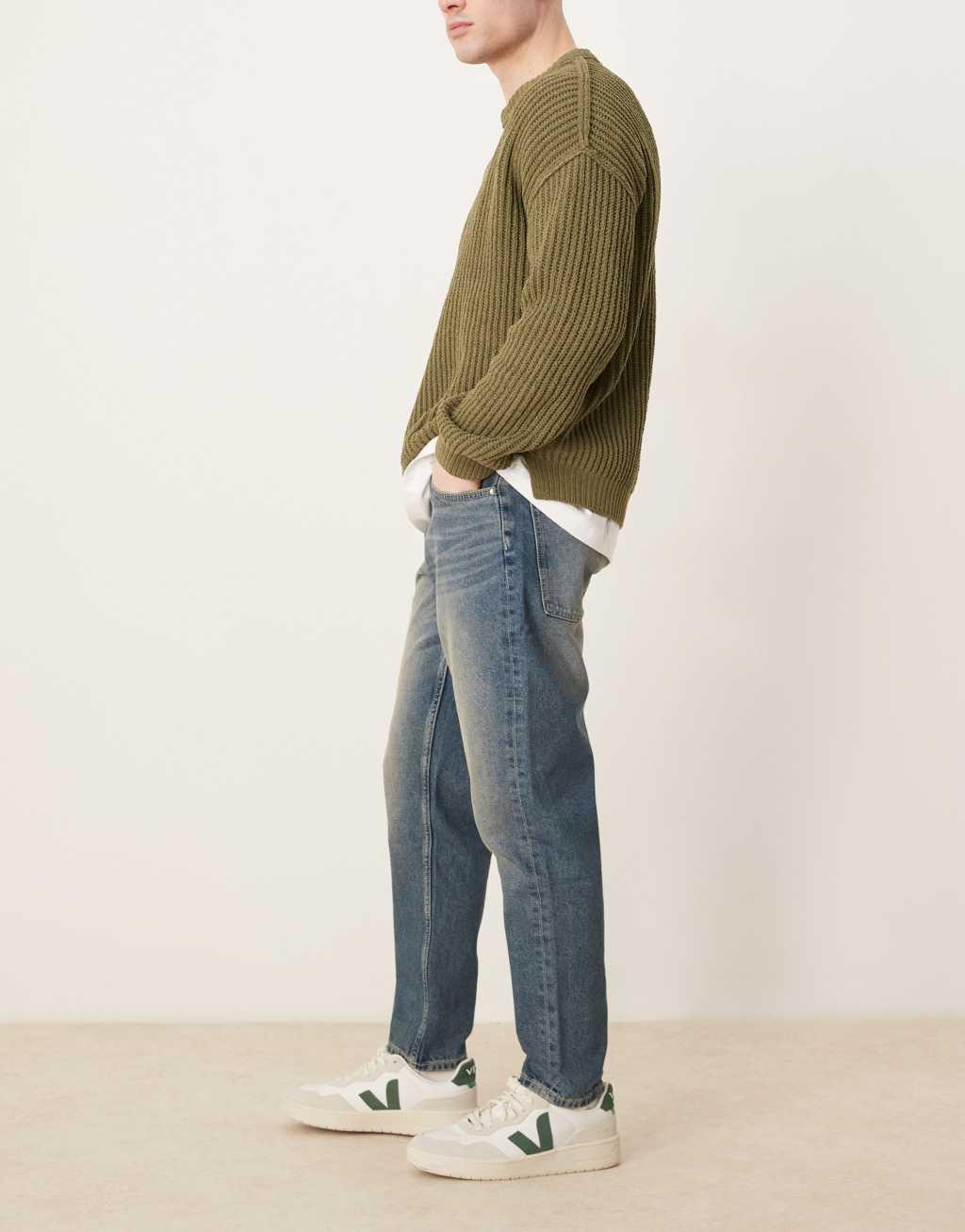 ASOS DESIGN tapered jeans in mid wash Product Image