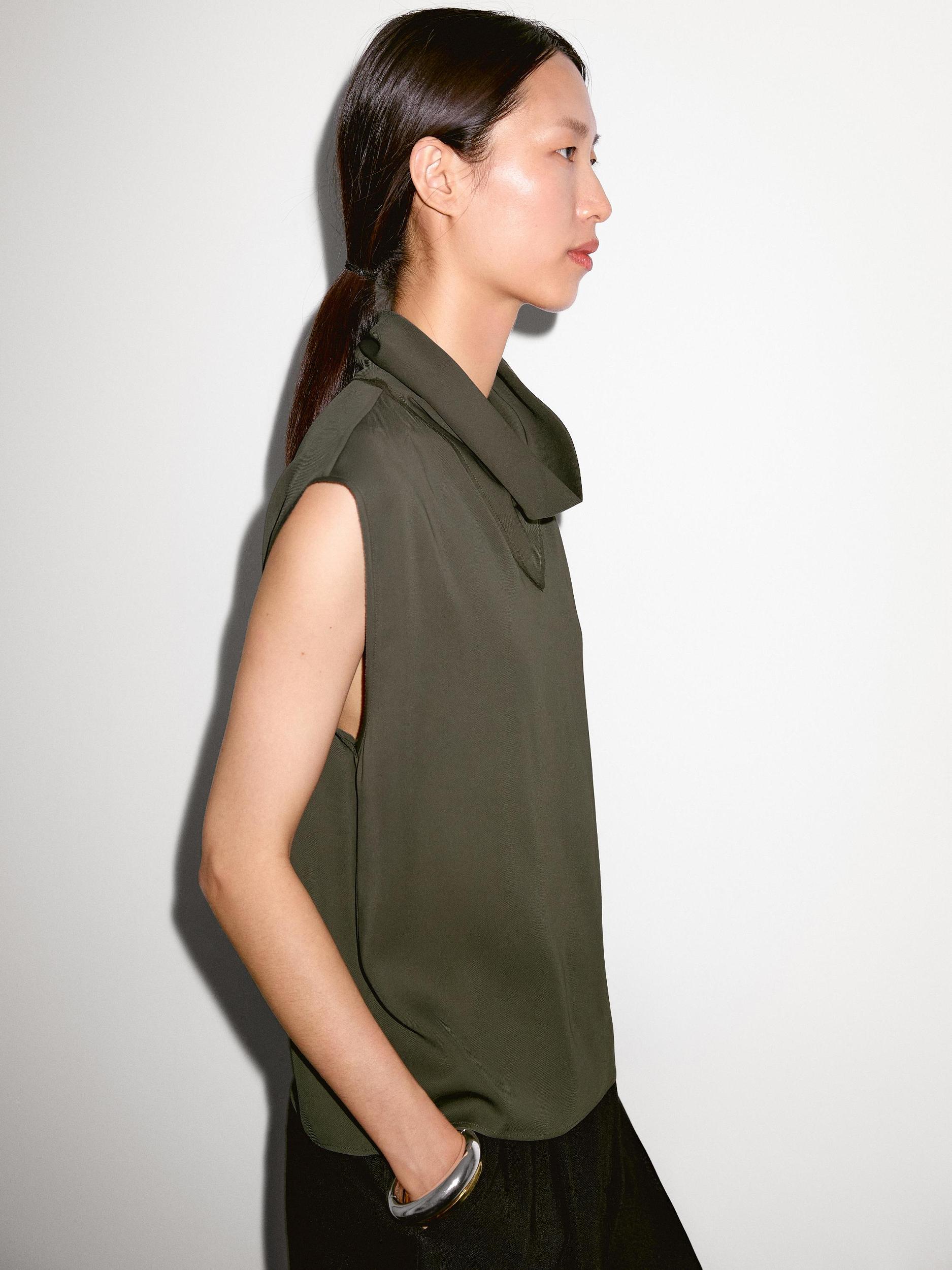 Flowing blouse with draped neck detail Product Image