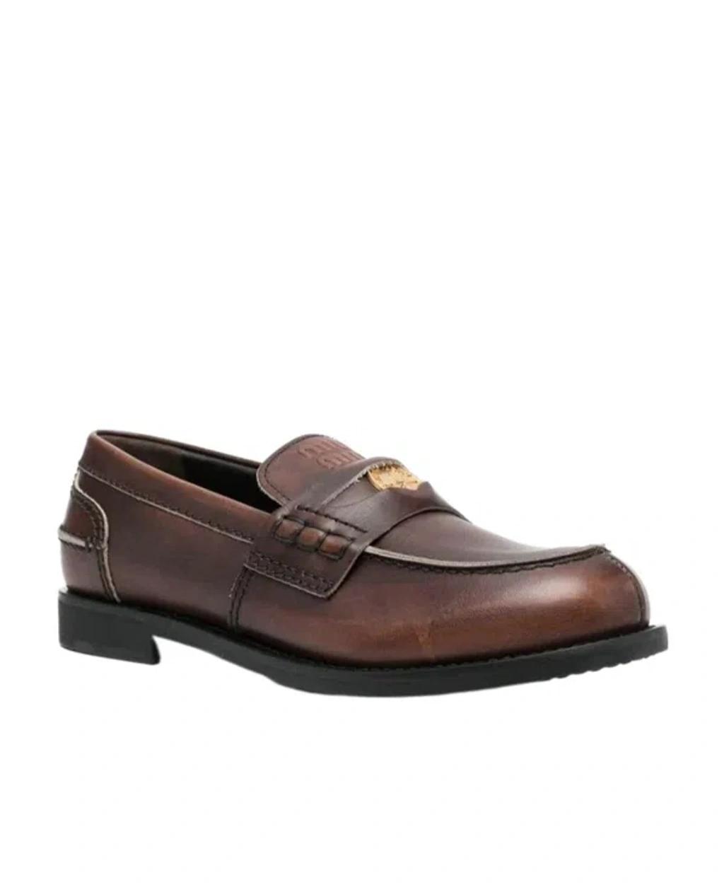MIU MIU Leather Distressed Penny Loafers In Brown Product Image