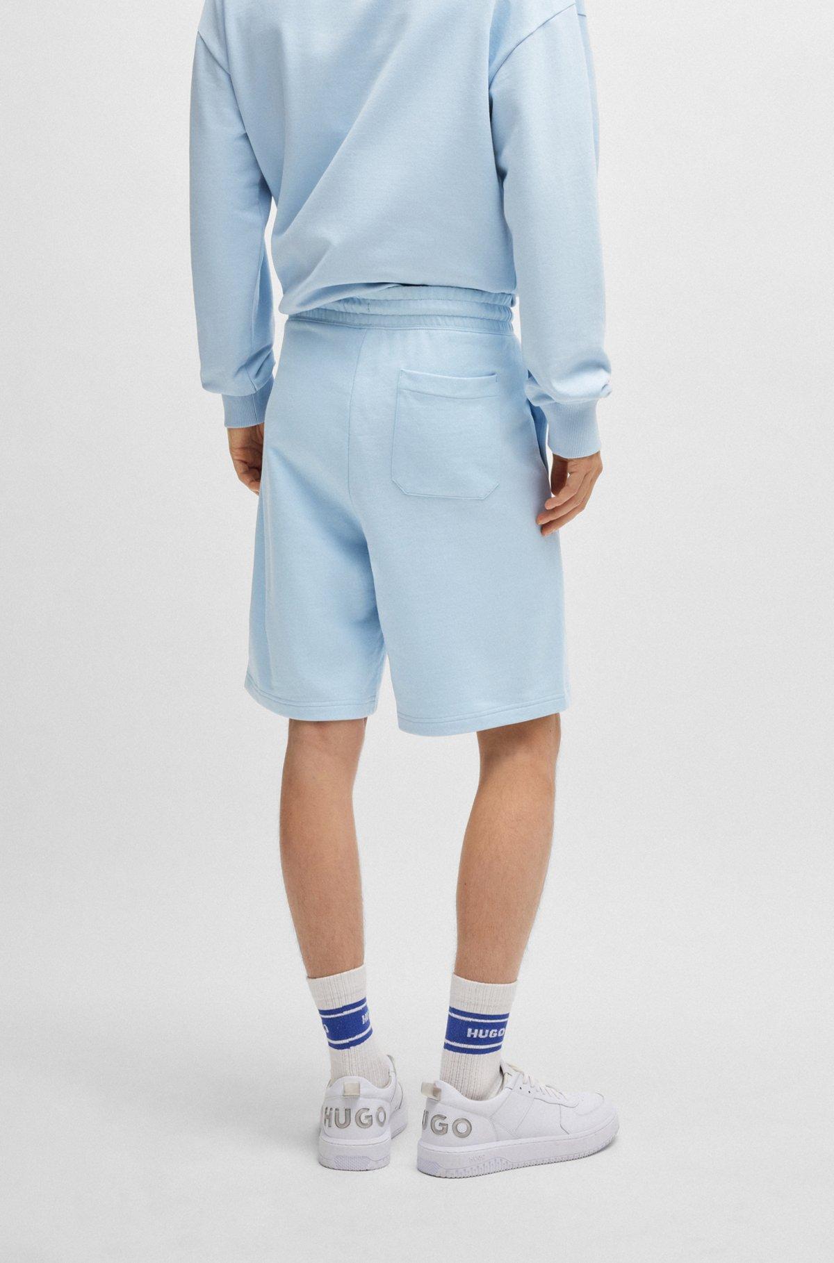 Cotton-terry shorts with blue logo patch Product Image