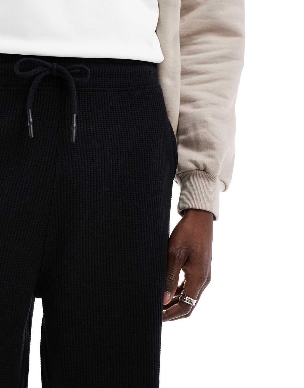 ASOS DESIGN oversized shorts in waffle textured black Product Image