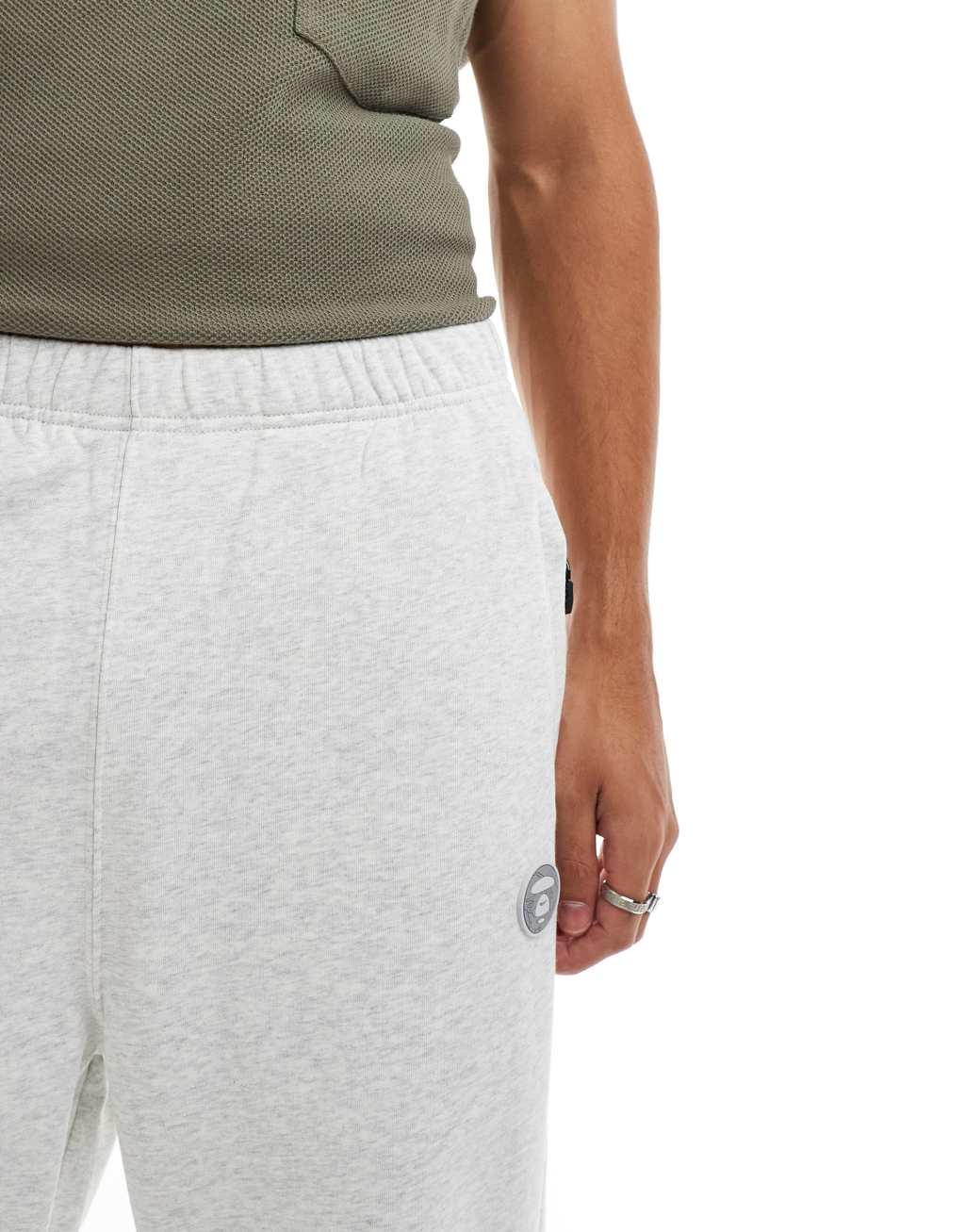 Aape By A Bathing Ape logo tapered sweatpants in heather gray Product Image