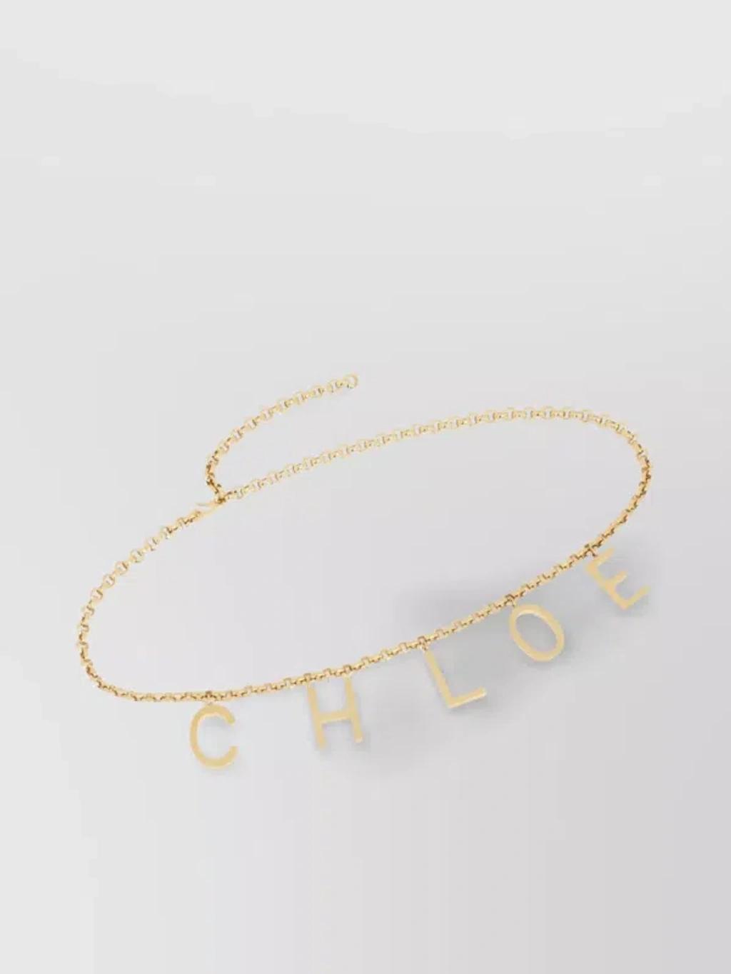 CHLOÉ Metallic Belt With Adjustable Hook Closure And Logo Lettering Charm In Brass Woman In Gold Product Image