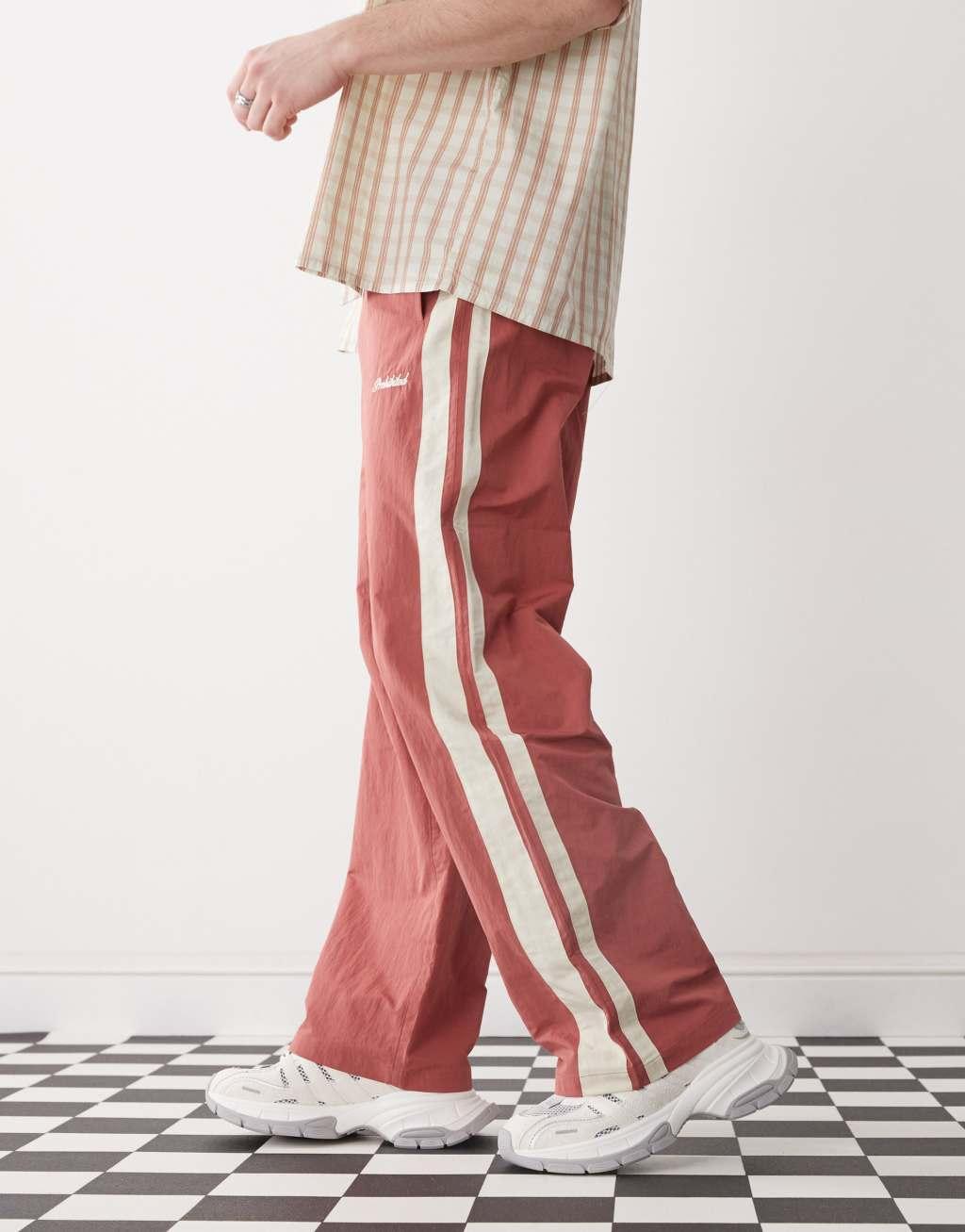 Prohibited stripe track pants in red Product Image