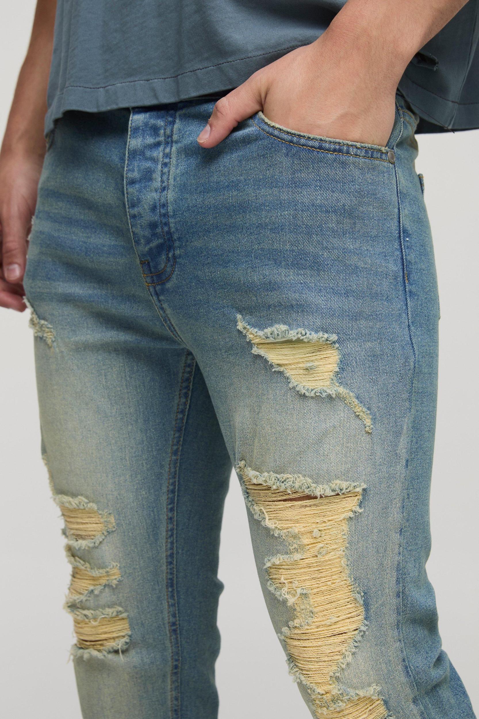 Skinny Stretch Stacked Flared Ripped Jeans | boohooMAN USA Product Image