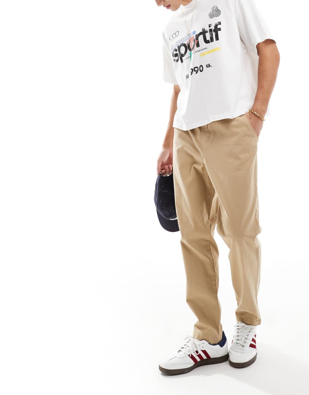 ASOS DESIGN tapered pull on chino with elastic waist in beige Product Image