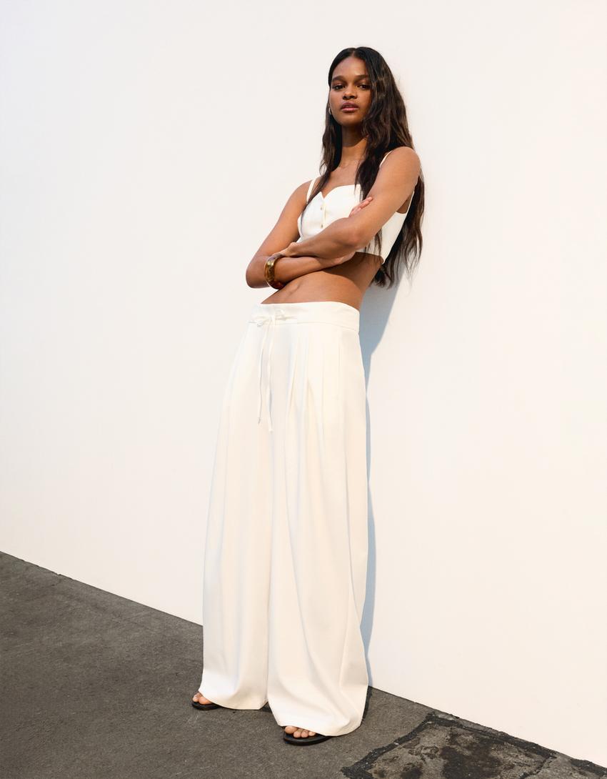 Flowing wide-leg pants with pleats Product Image