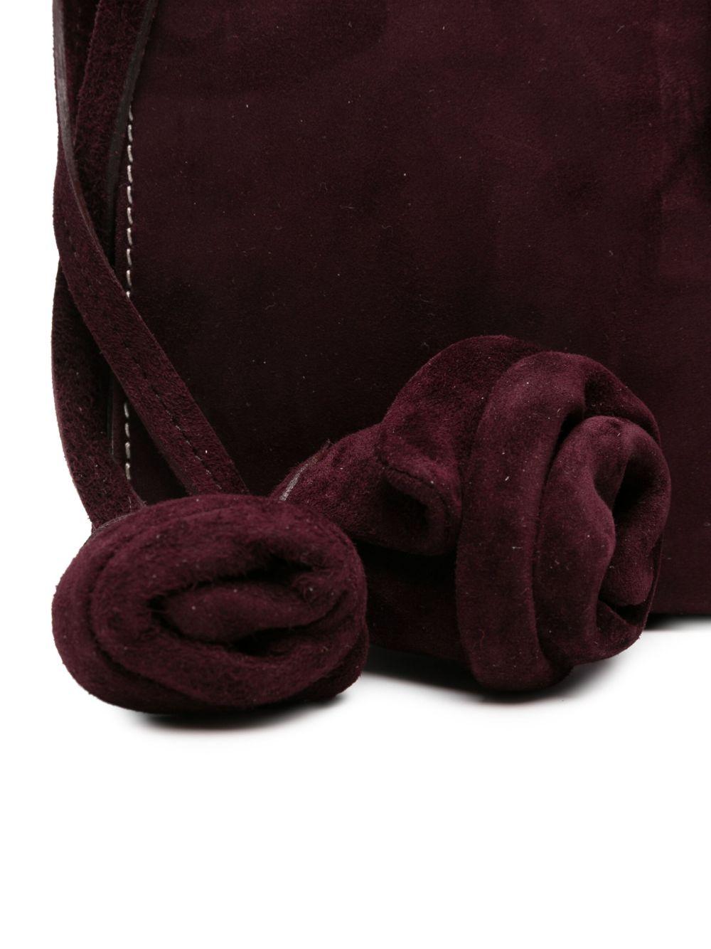 Apolonia rose-embellished suede clutch bag Product Image