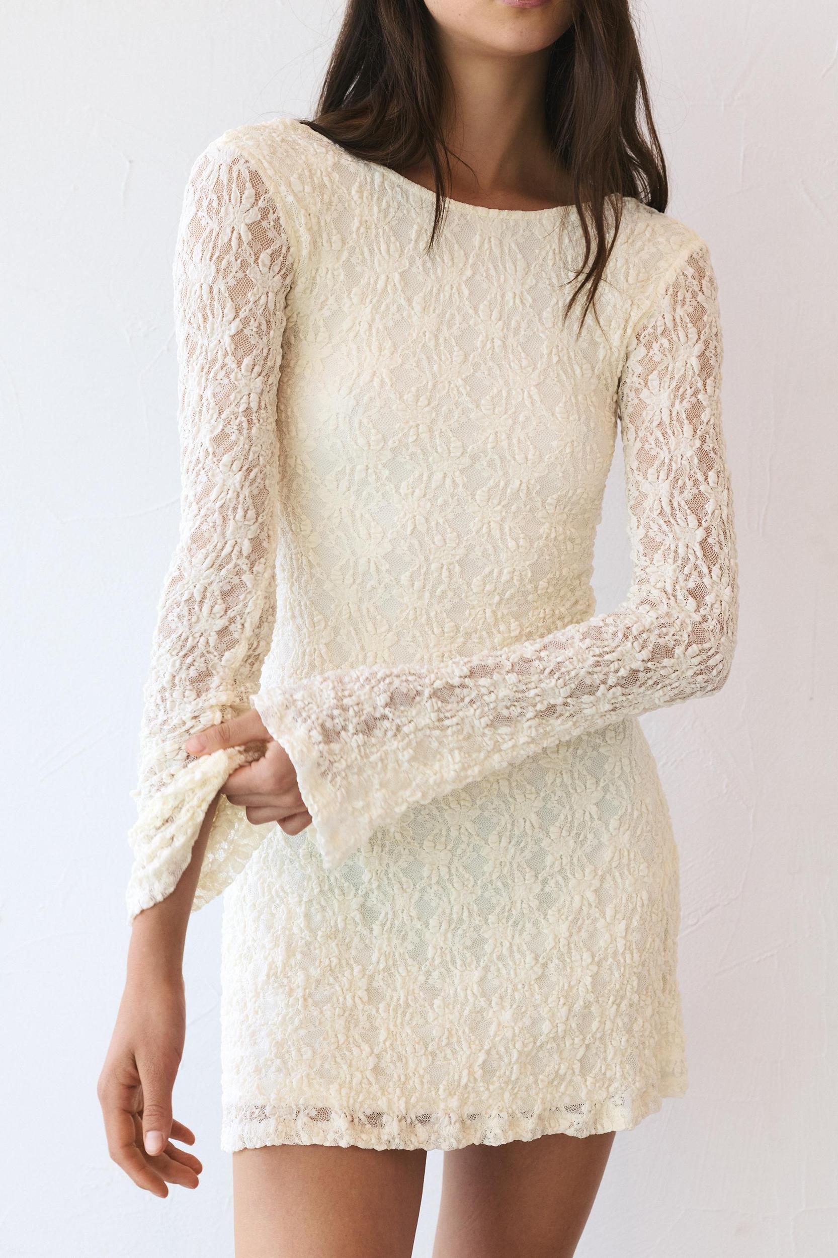 Short lace dress with long sleeves Product Image