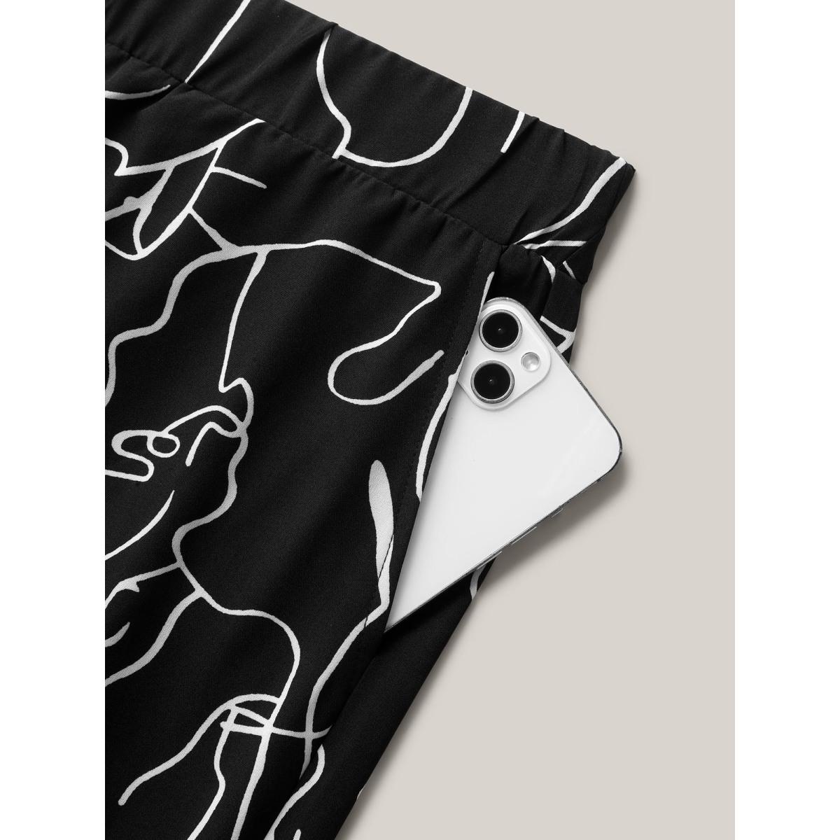 Plus Size Abstract Print Flowy Wide-Leg Pants Women Black Office Wide Leg Mid Rise Office Pants BloomChic 12/L Product Image