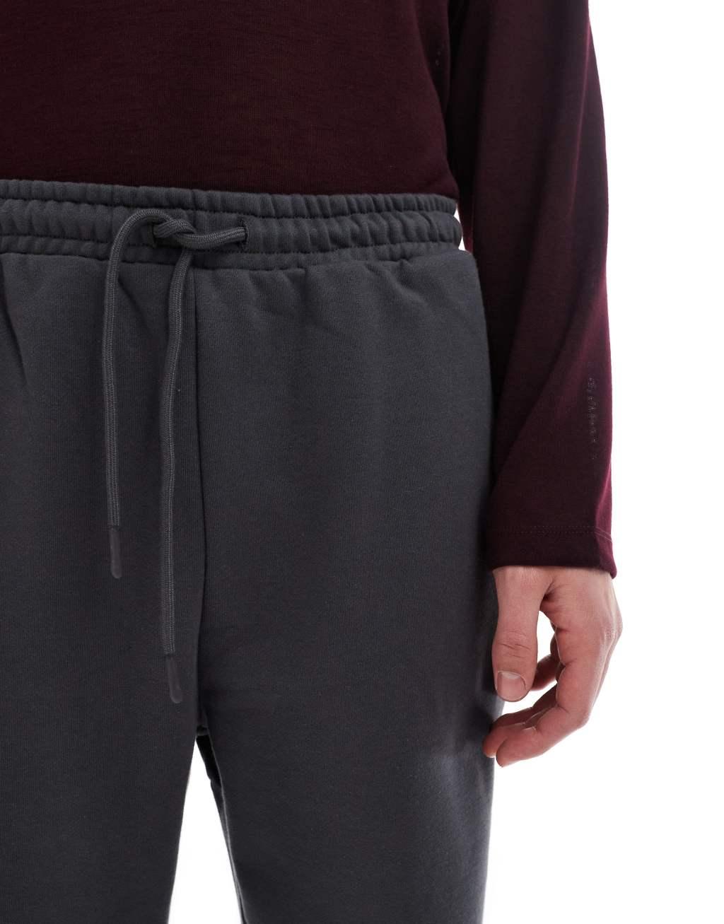 ASOS DESIGN premium heavyweight tapered sweatpants in washed black Product Image