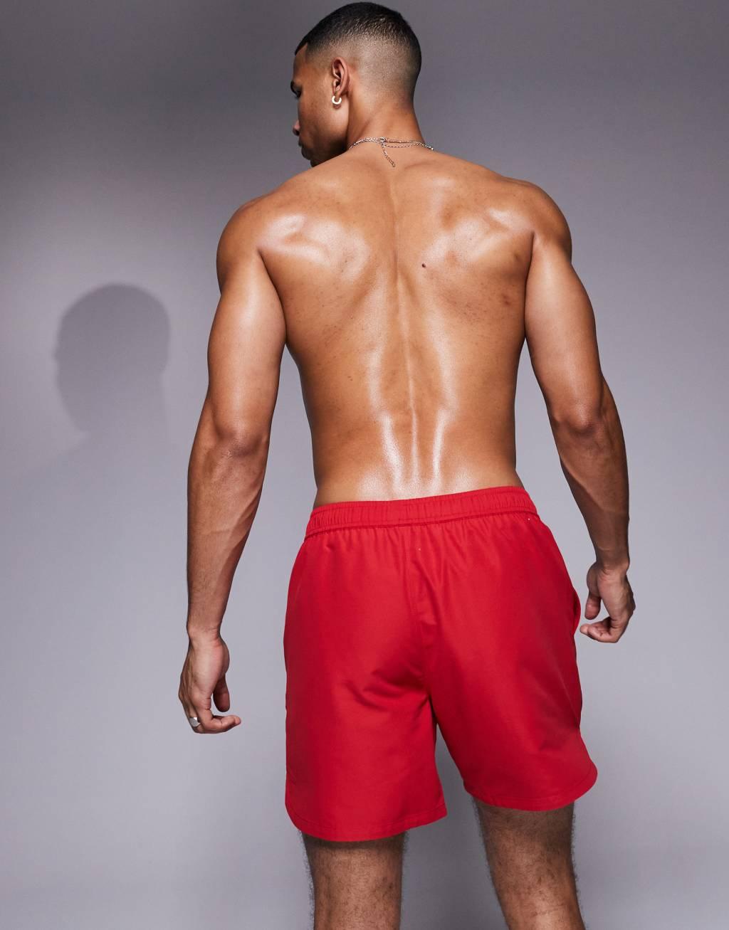 ASOS DESIGN swim shorts in mid length with embroidery in red Product Image