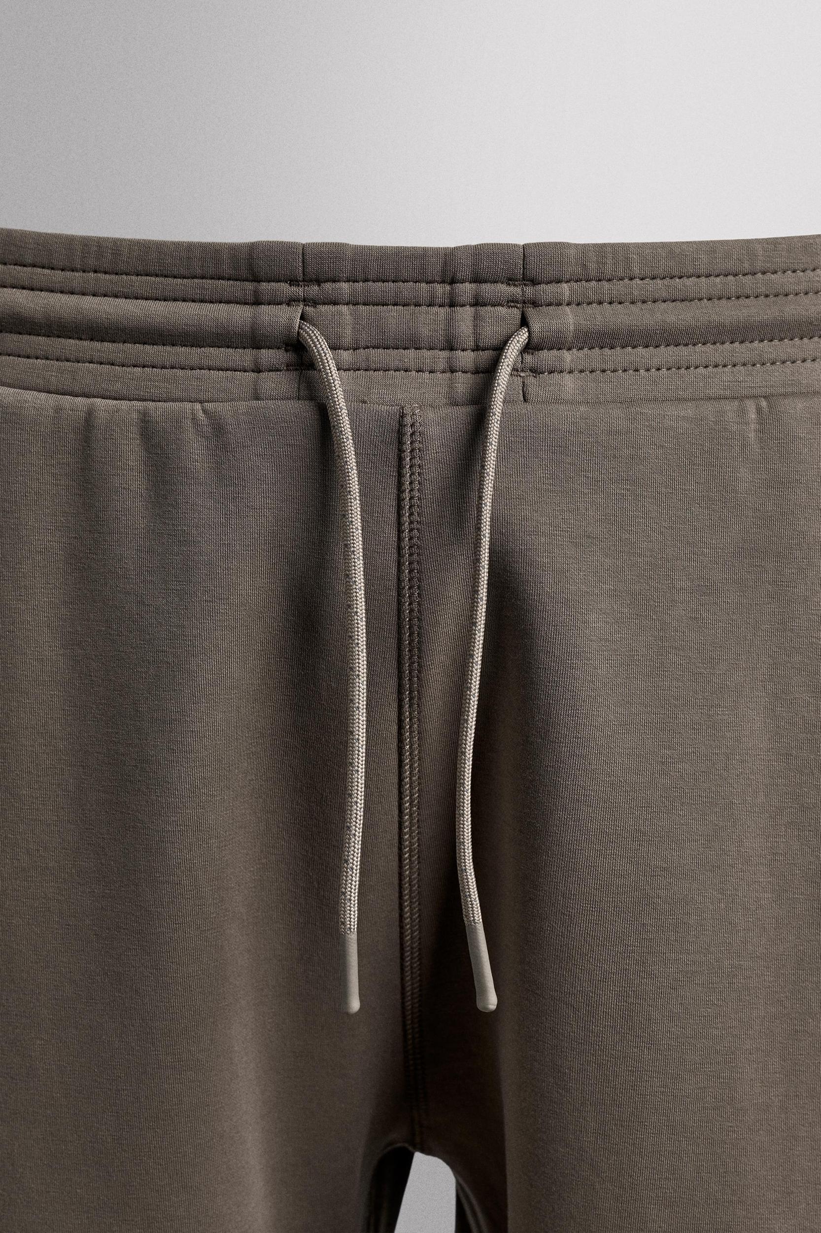 TECHNICAL ZIPPER PANTS Product Image