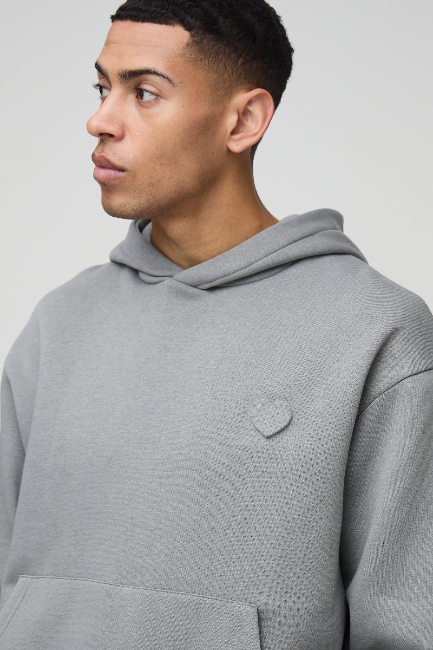 Oversized Boxy Embossed Heart Hoodie | boohooMAN USA Product Image