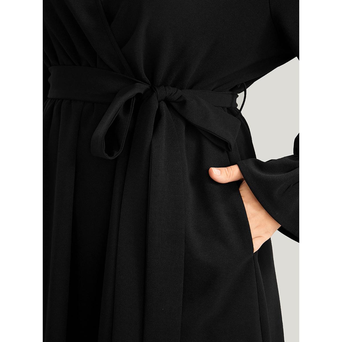 Plus Size Solid Wrap Pocket Belted Laser Cut Knee Dress Black Women Elegant Plain V-neck Long Sleeve Curvy Knee Dress BloomChic 10/M Product Image