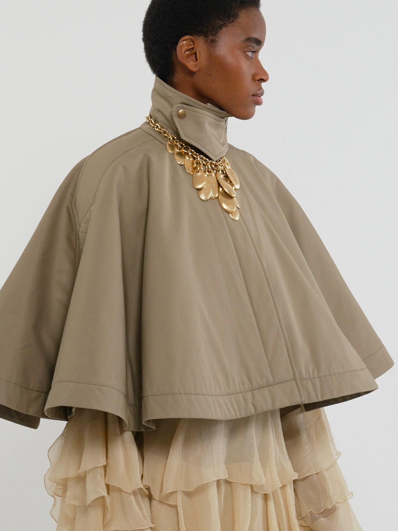 Short quilted cape in cotton gabardine Product Image