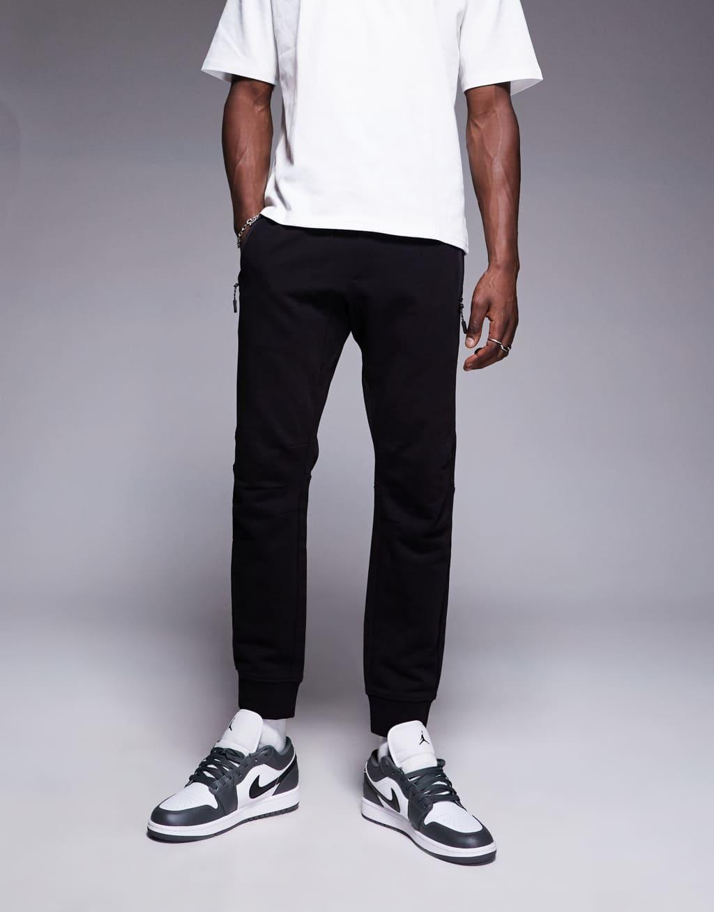 Armani Exchange logo cuffed sweatpants in black Product Image