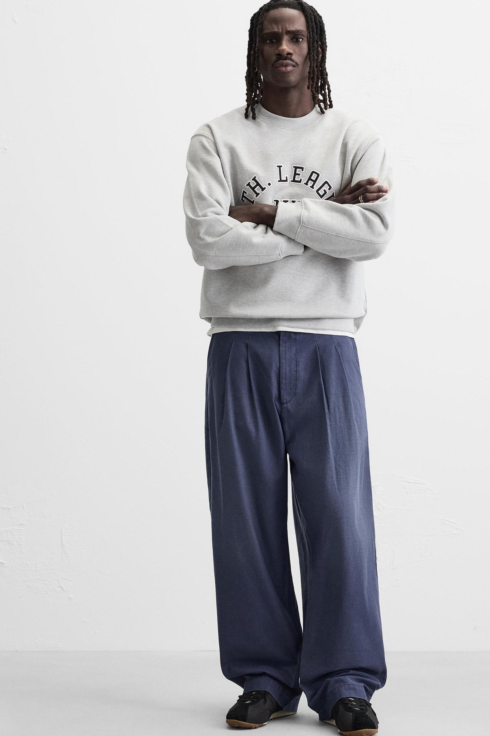 RELAXED FIT PLEATED JEANS Product Image