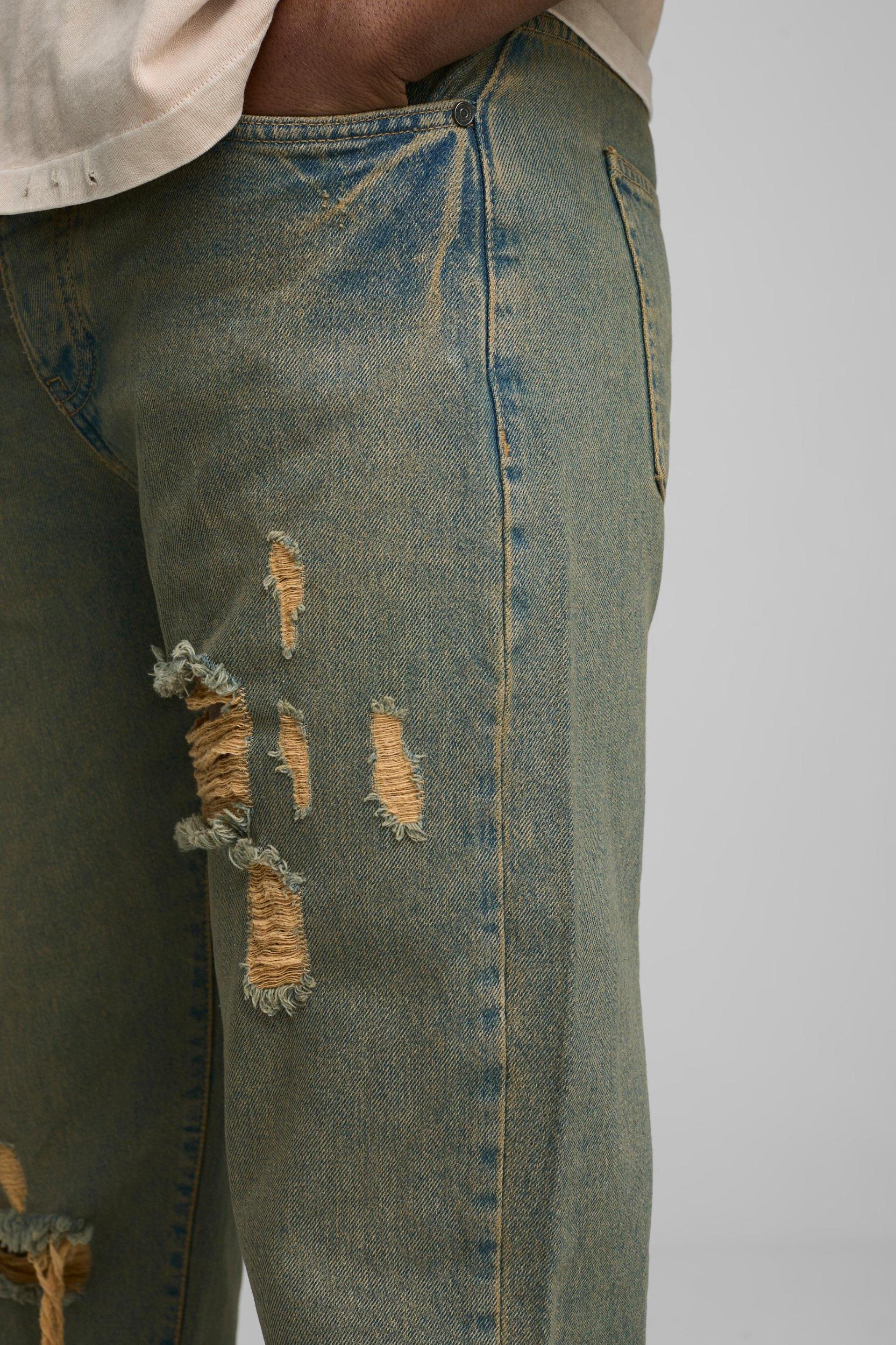 Relaxed Flared Ripped Knee Antique Wash Jeans | boohooMAN USA Product Image