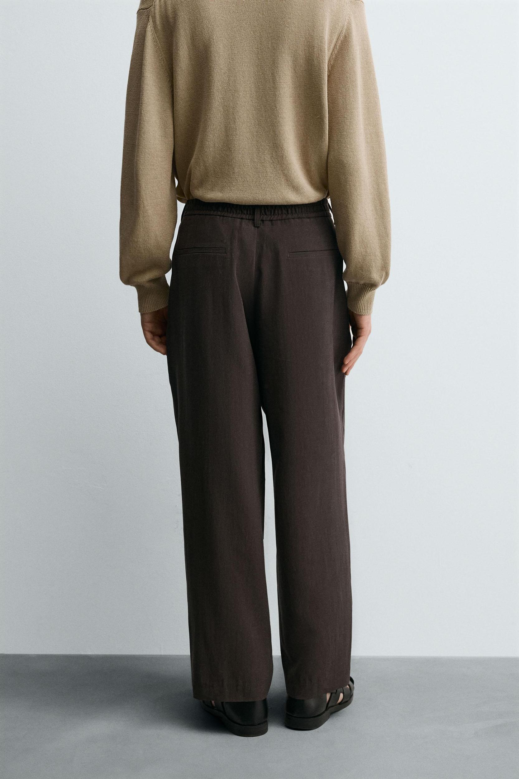 PLEATED FLOWY PANTS Product Image