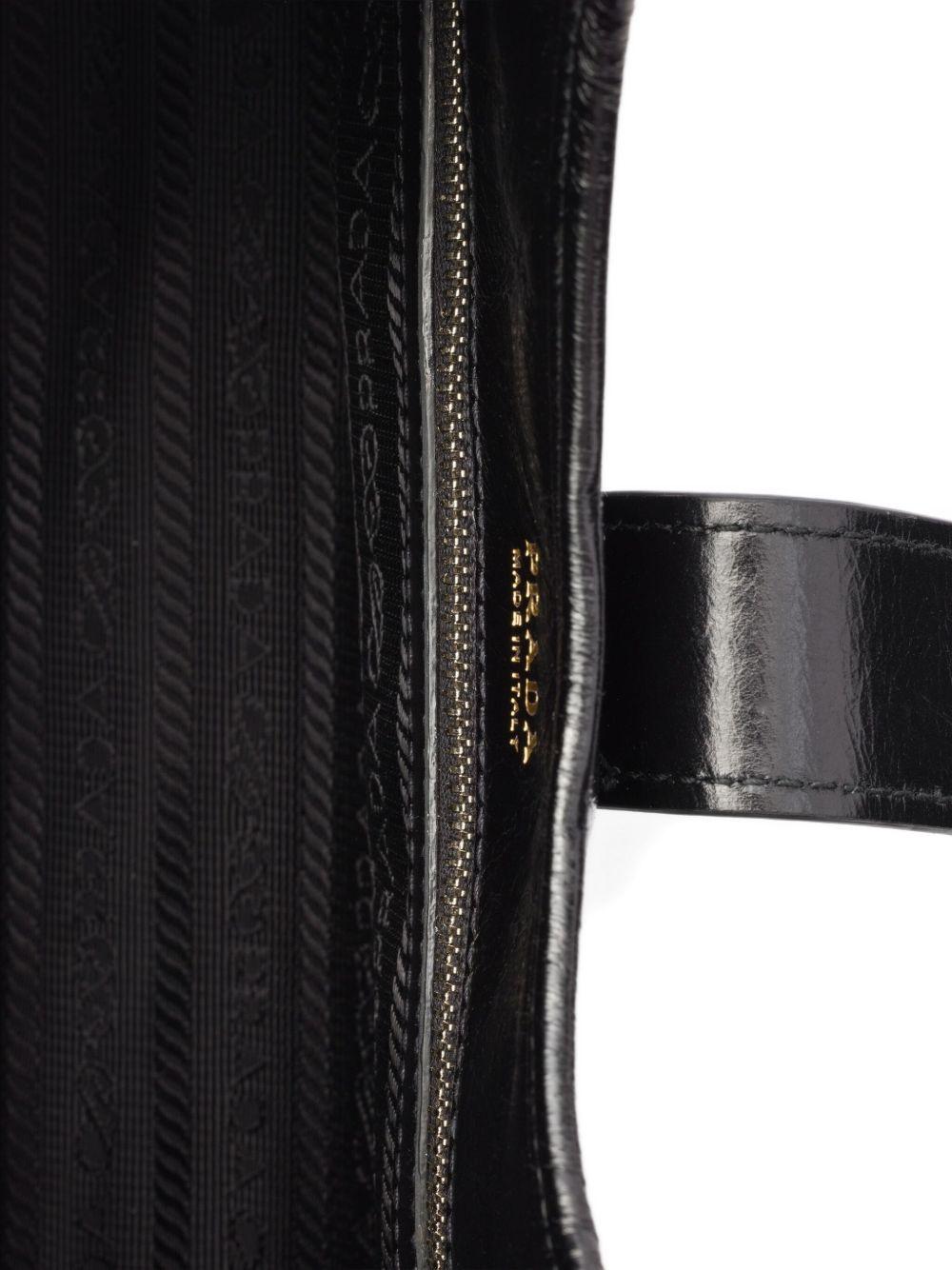 small push-lock leather tote bag Product Image