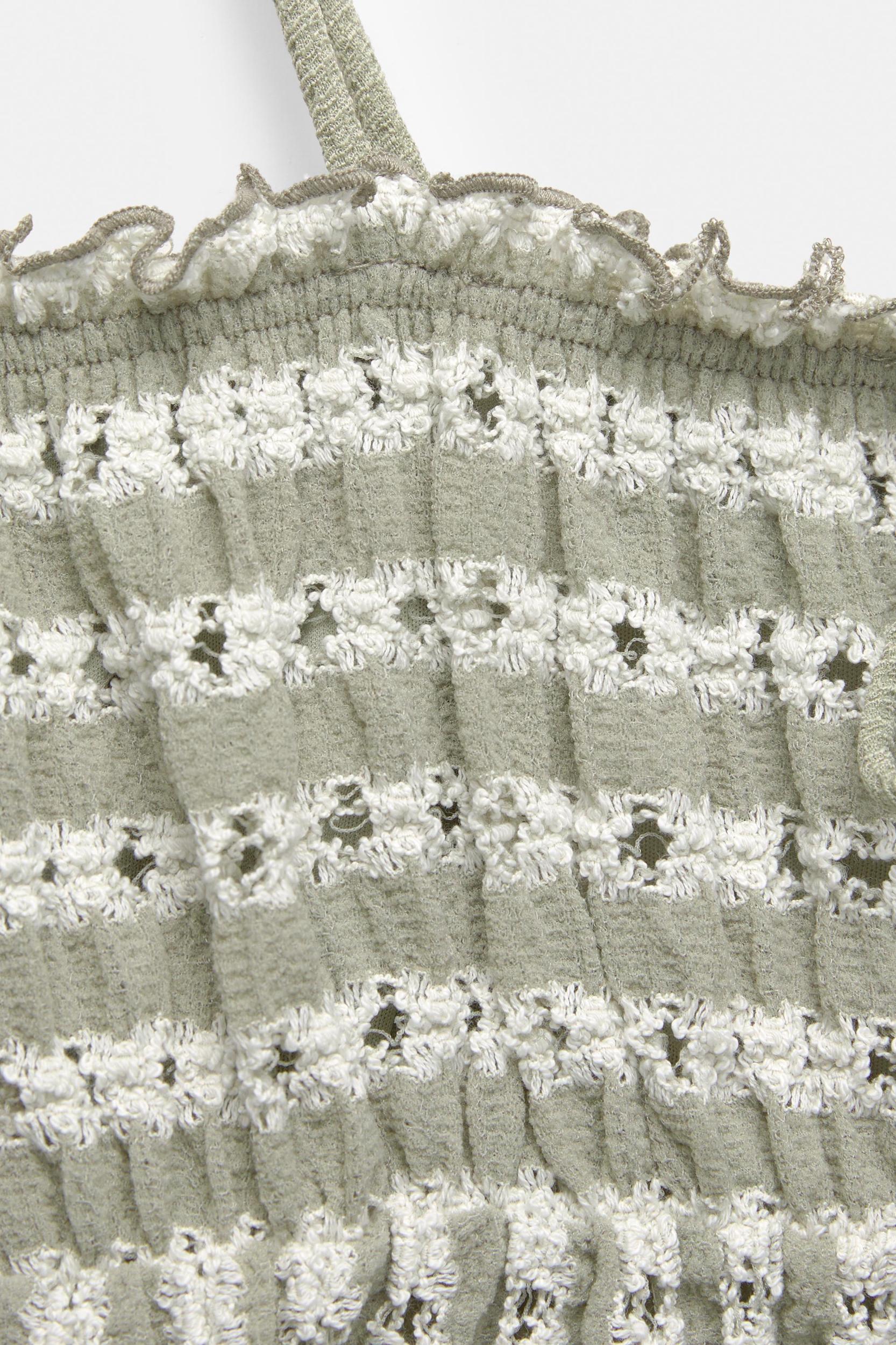 Open-knit top with bows Product Image