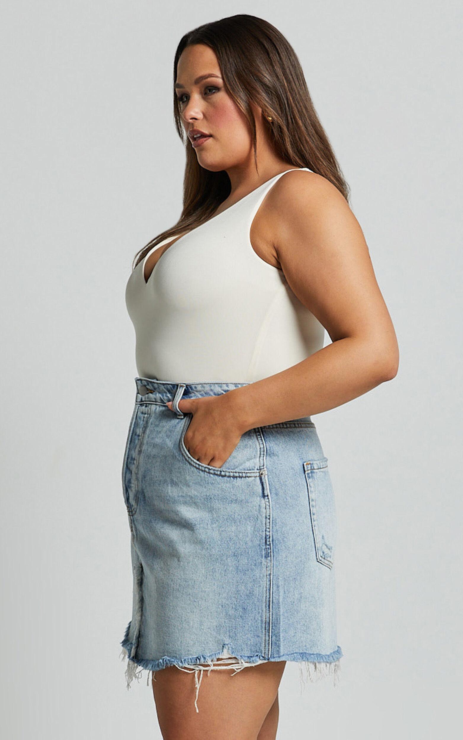 Pieta Mini Skirt - Recycled Cotton Raw Hem Denim Skirt in Mid Blue Wash Product Image