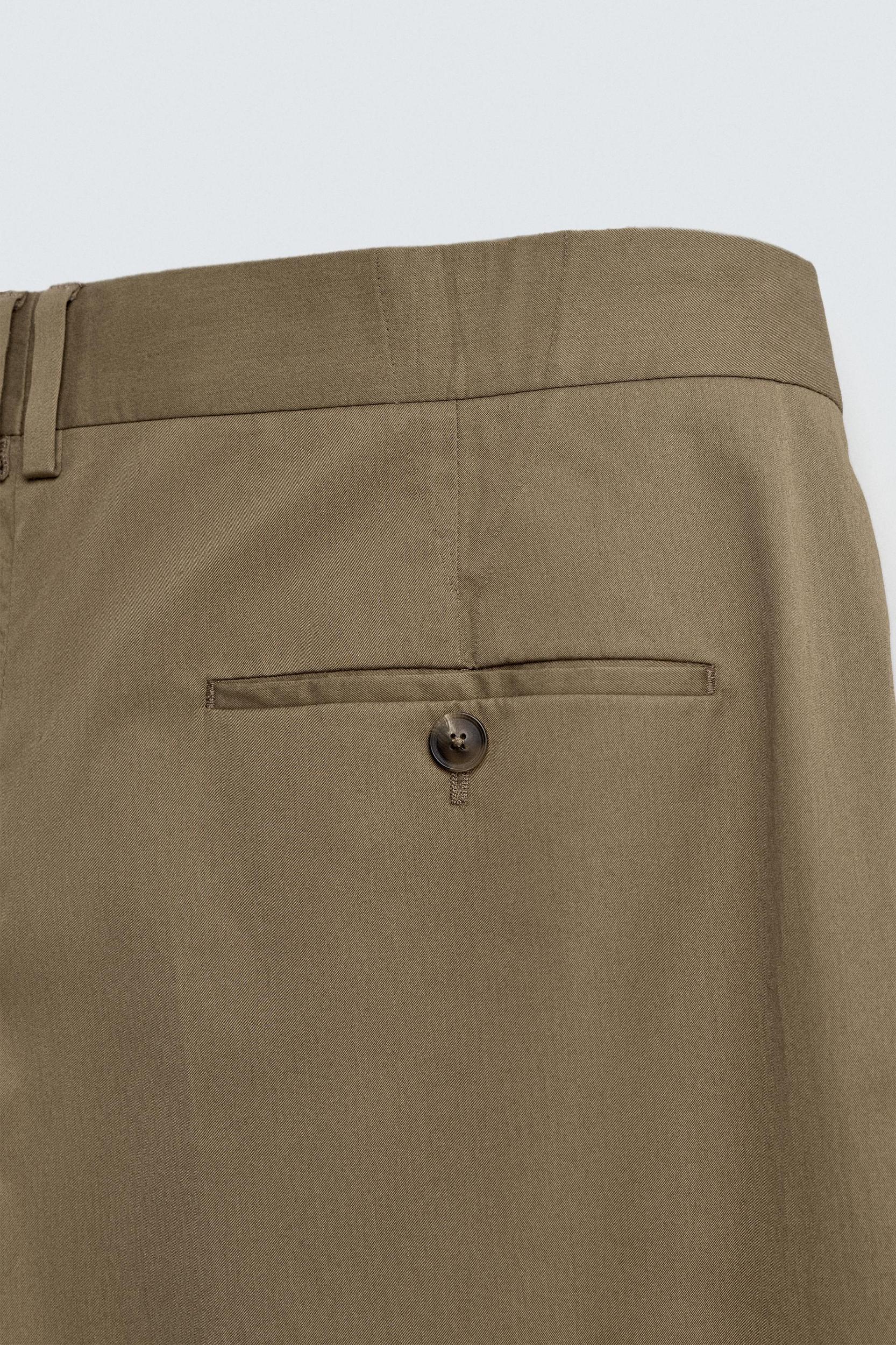 LIMITED EDITION RELAXED FIT PLEATED PANTS Product Image