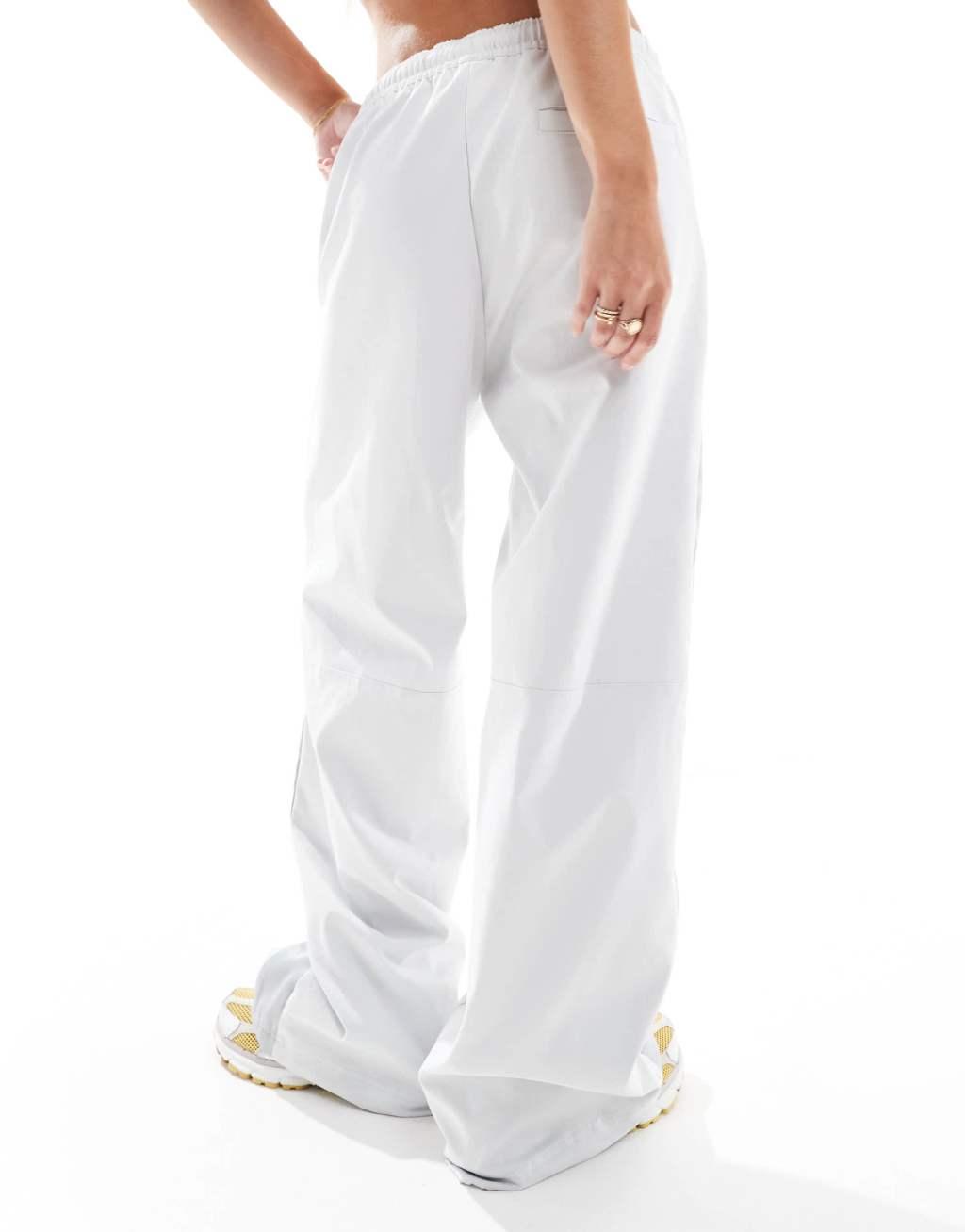 Nike panelled woven pants in gray Product Image