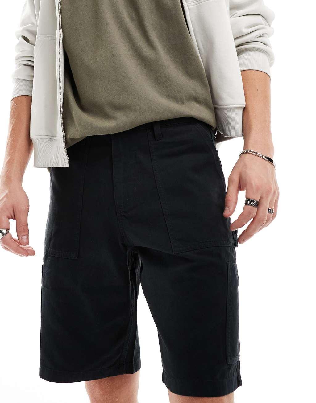 ASOS DESIGN cargo shorts in black with carpenter detail Product Image