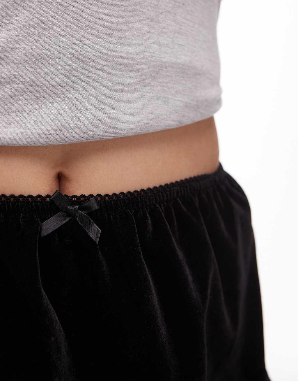 Topshop velvet mini skirt with lace trim in black Product Image