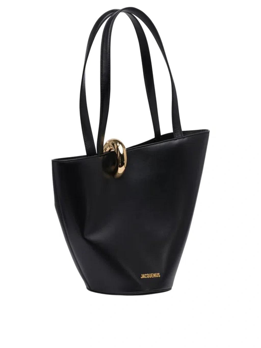 JACQUEMUS The Medium Bambola Asymmetric Leather Bucket Bag In Black 990 Product Image