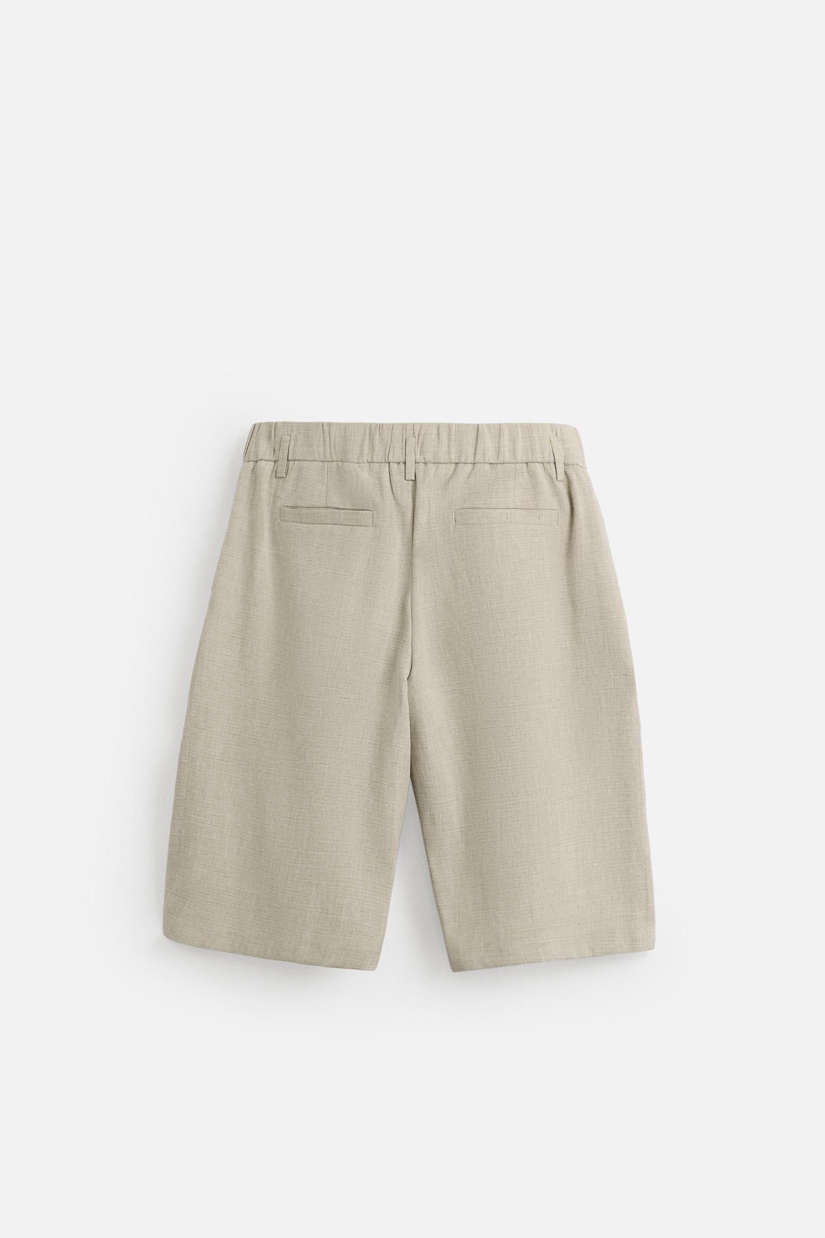 PLEATED WIDE FIT BERMUDA SHORTS Product Image