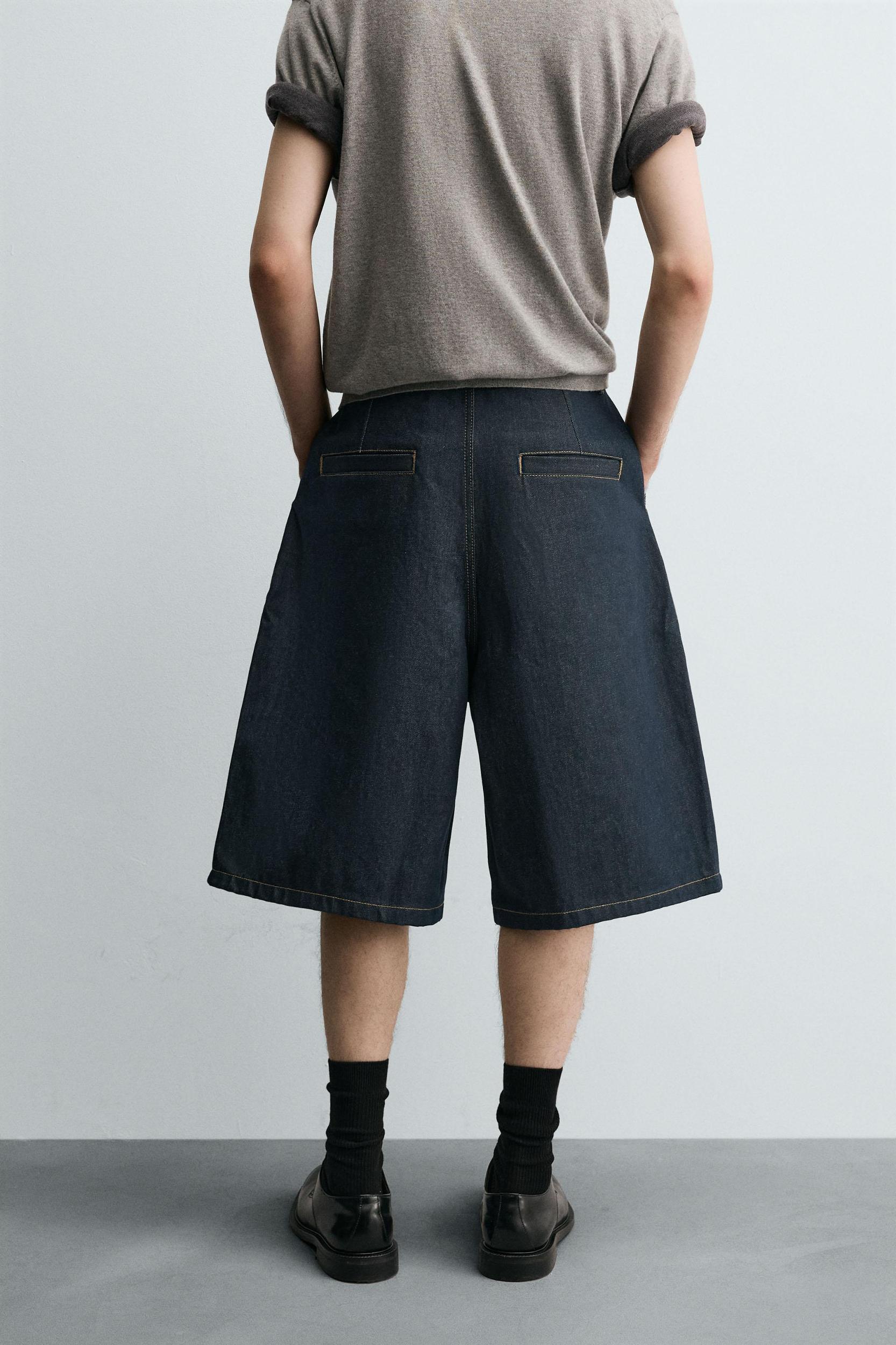 RELAXED FIT PLEATED DENIM SHORTS Product Image