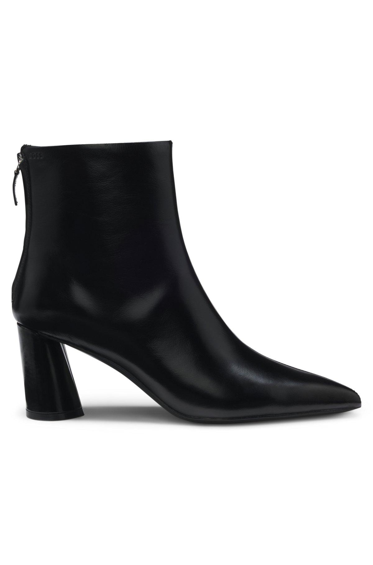 Ankle boots in leather with embossed logo Product Image