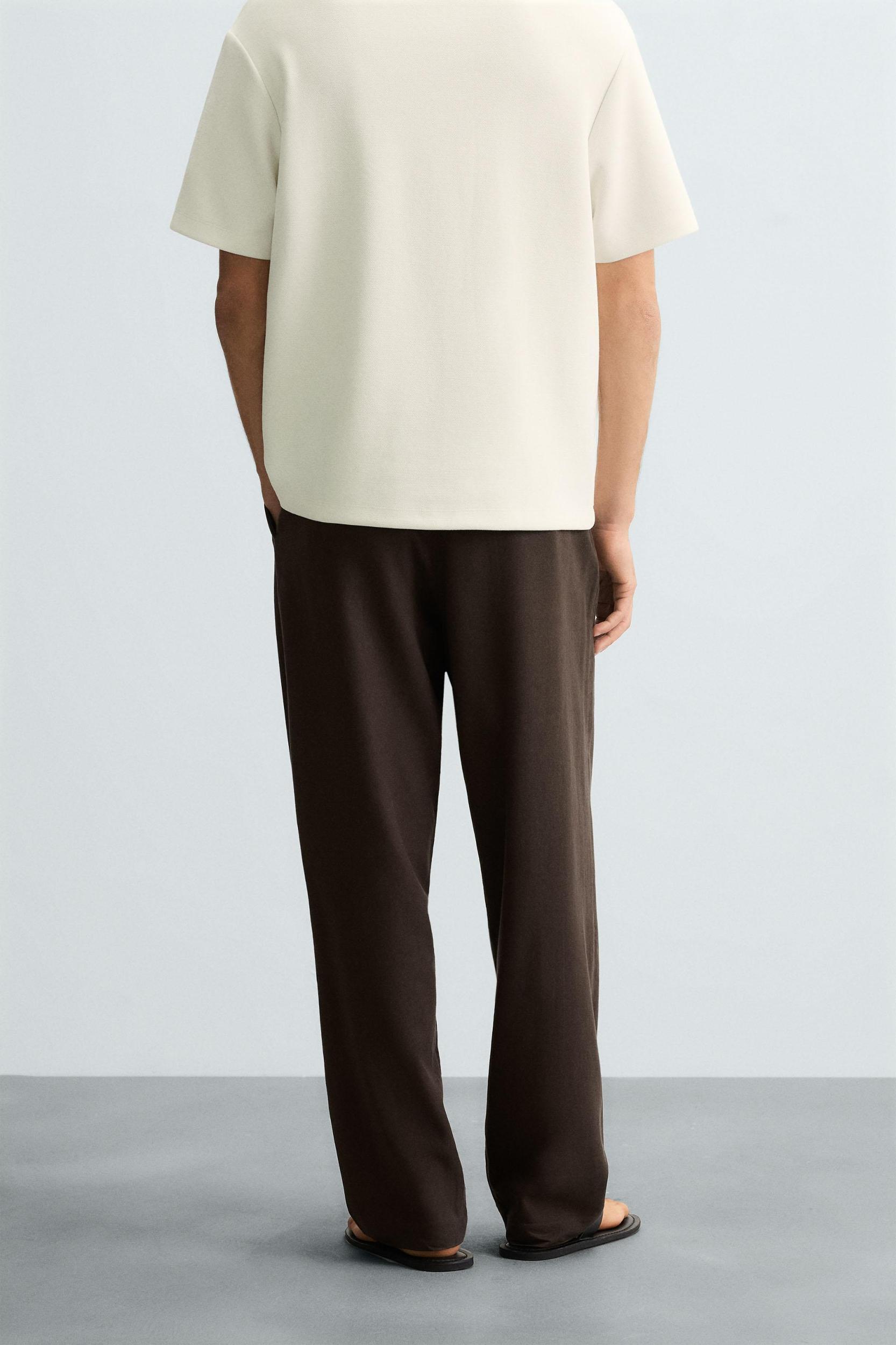 FLOWY PLEATED PANTS Product Image