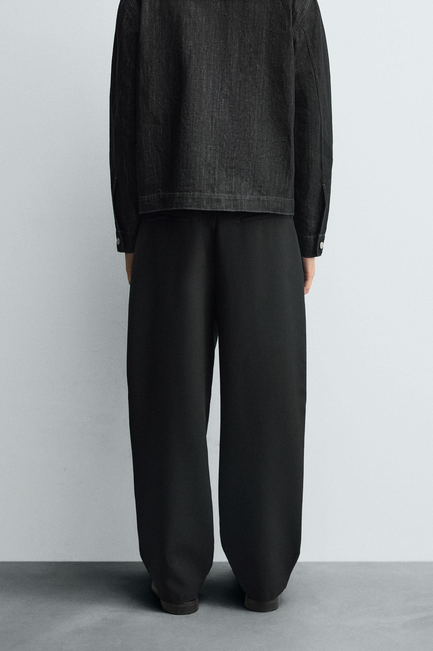 RELAXED FIT PLEATED PANTS Product Image